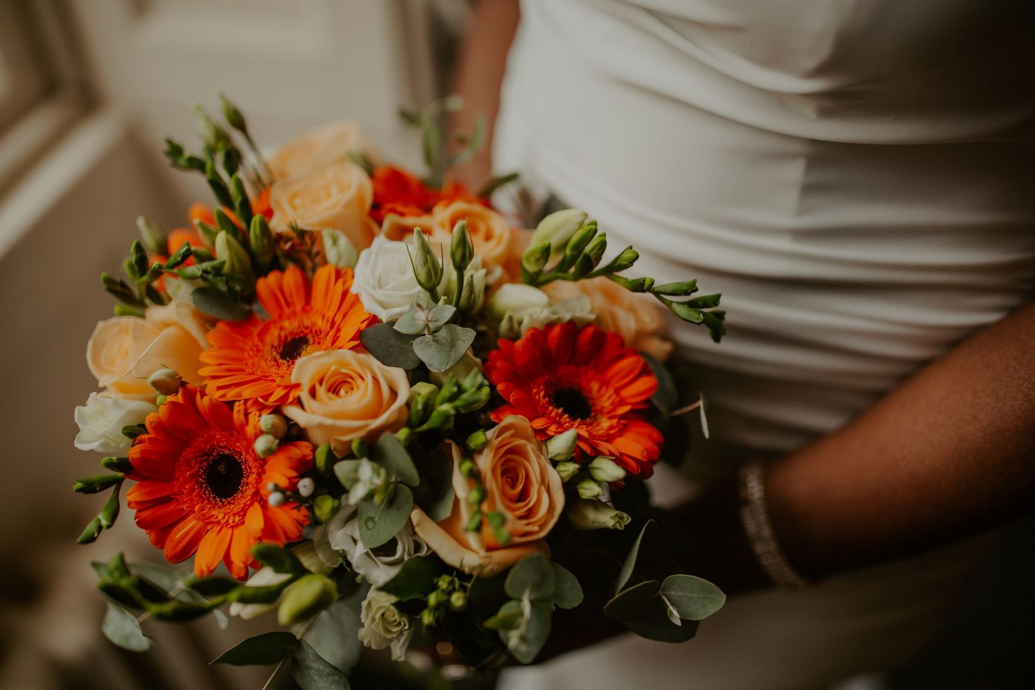 Bride holding her citrus colour bouquet at Morden Park House - London - RELM Photography