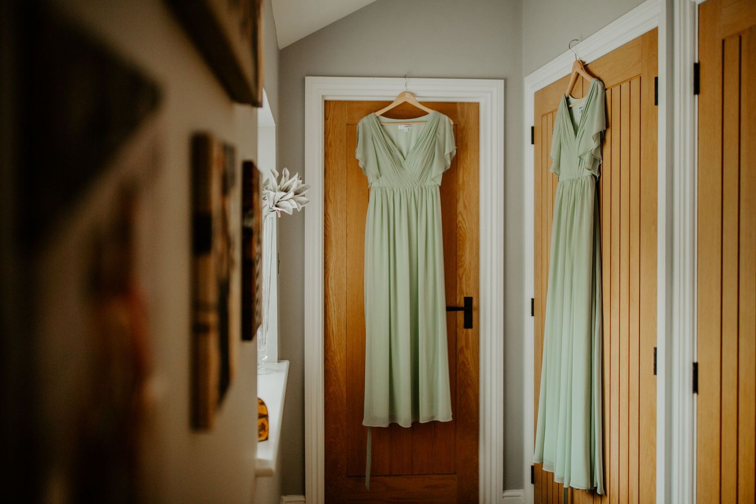 Celery green bridesmaid dresses hanging on doors Hertfordshire, Photographer RELM Photography