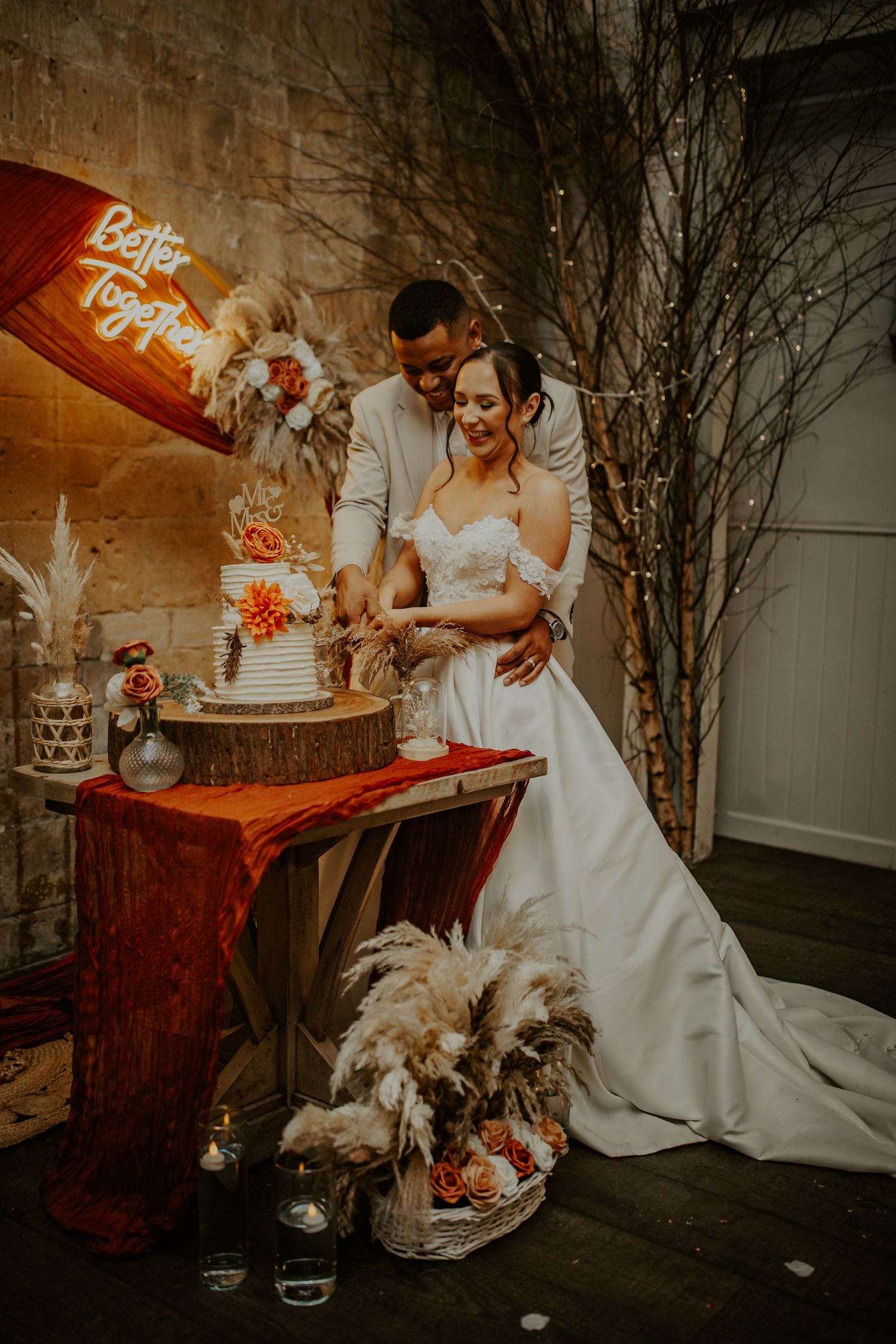 Bride and groom cutting their wedding cake at their wedding venue Lapstone Barn – Chipping Campden, The Cotswolds
