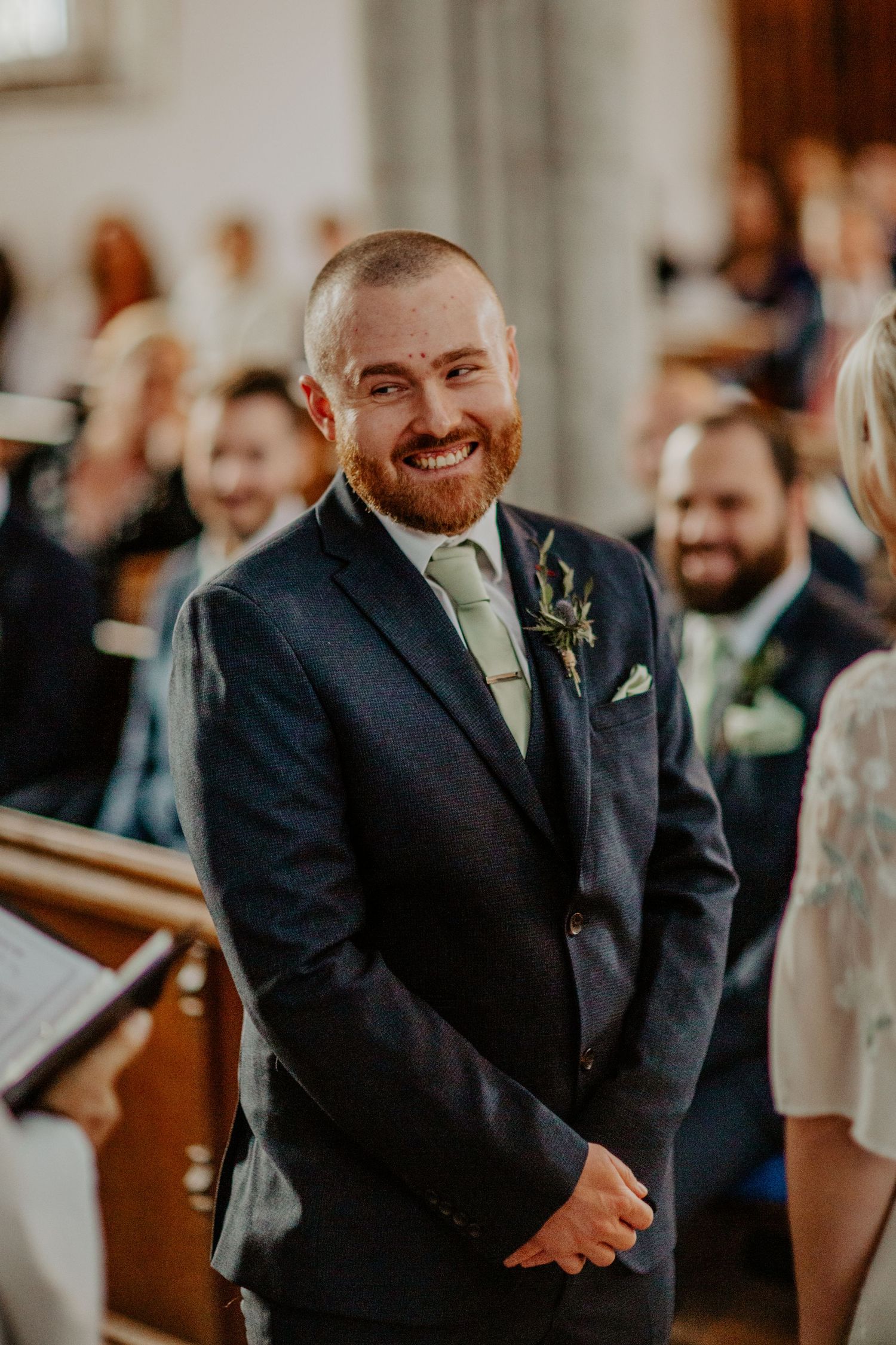 Groom excited at Braughing Church, Hertfordshire – RELM Photography.