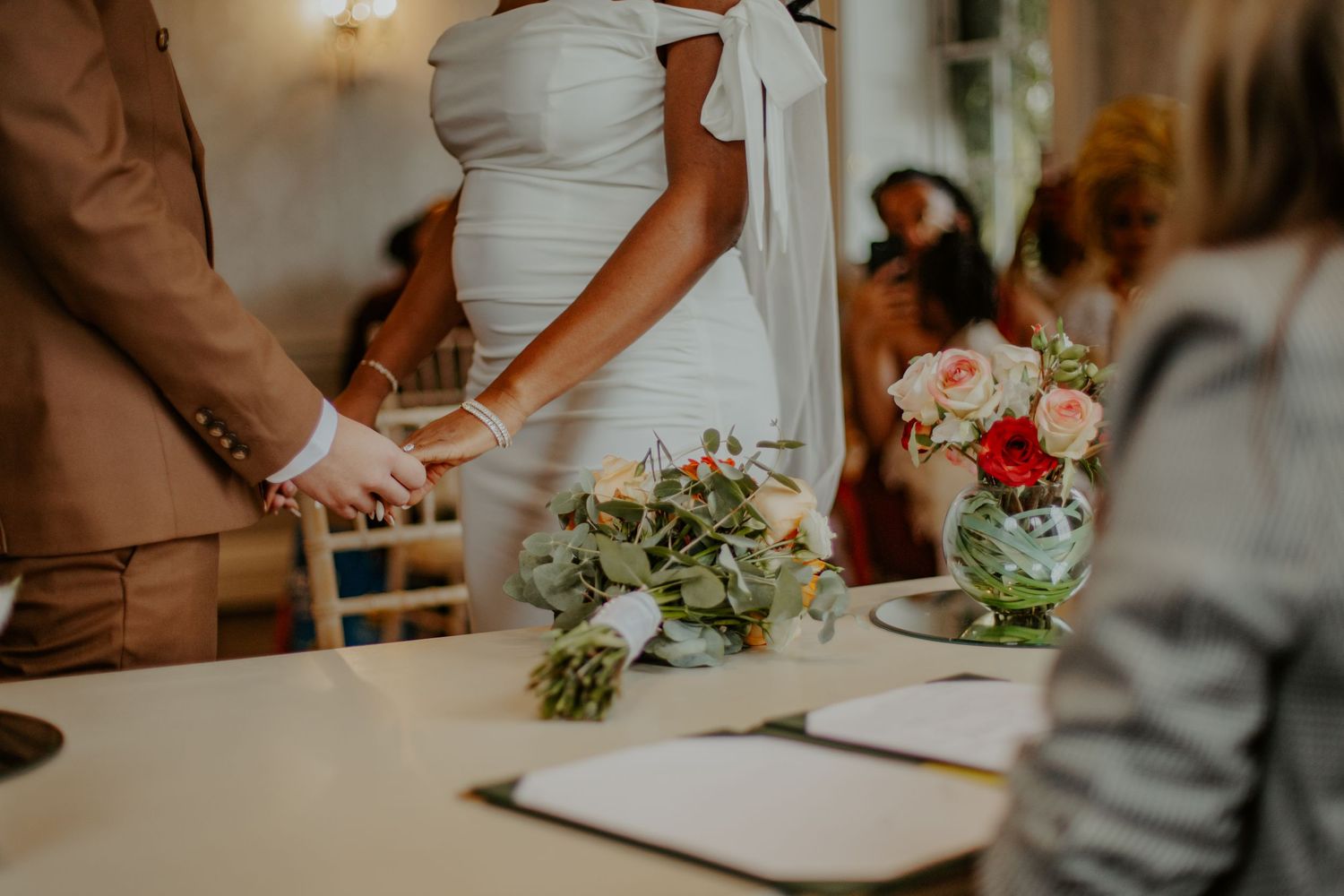 Bride and Groom holding hands at their wedding ceremony at Morden Park House - London - RELM Photography