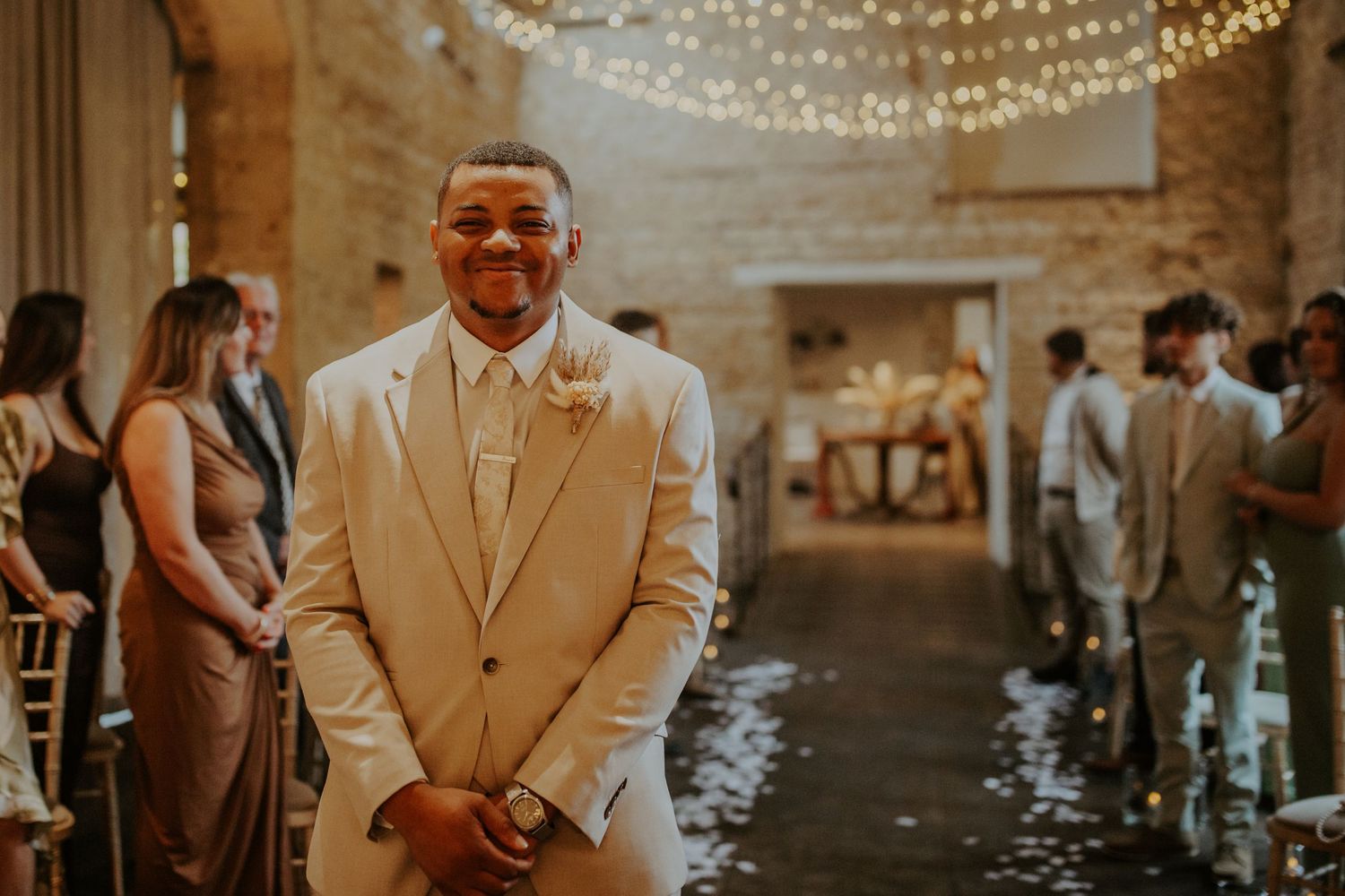 Groom waiting for his bride at their wedding ceremony - Lapstone Barn – Chipping Campden, The Cotswolds