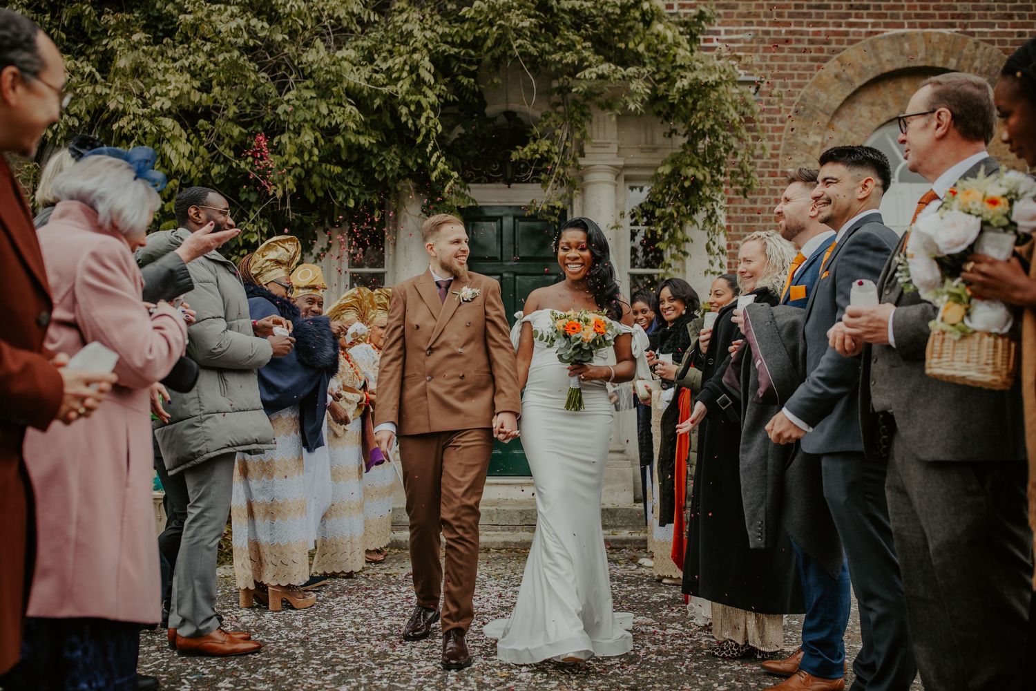 Bride and Groom doing a confetti walk outside Morden Park House - London - RELM Photography
