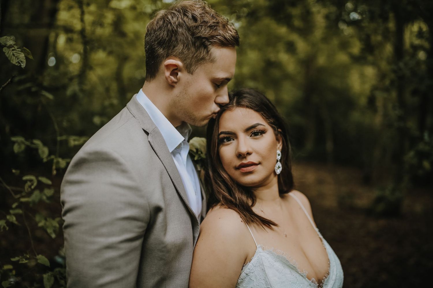 Bride and groom posing in the woods of Harpenden, Hertfordshire - RELM Photography