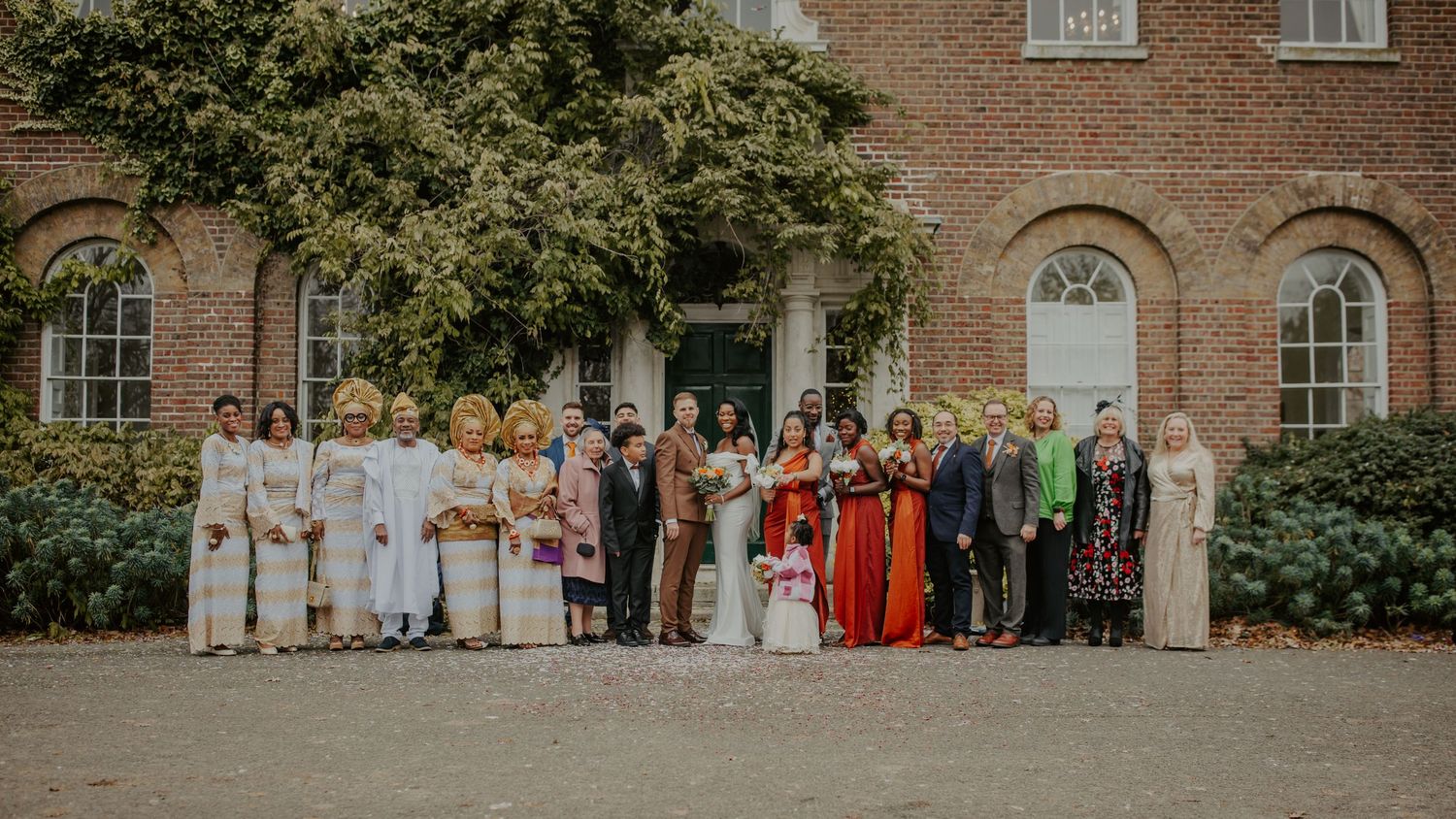 Bride and Groom with family outside Morden Park House - London - RELM Photography