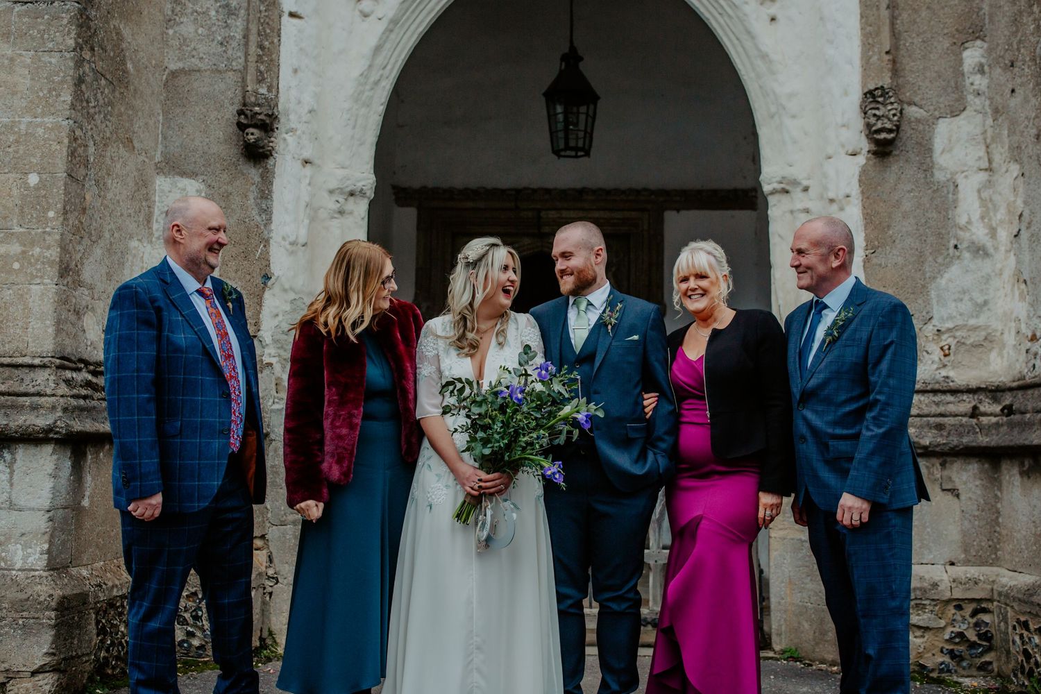 Bride and groom with parents outside Braughing Church Hertfordshire, Photographer RELM Photography