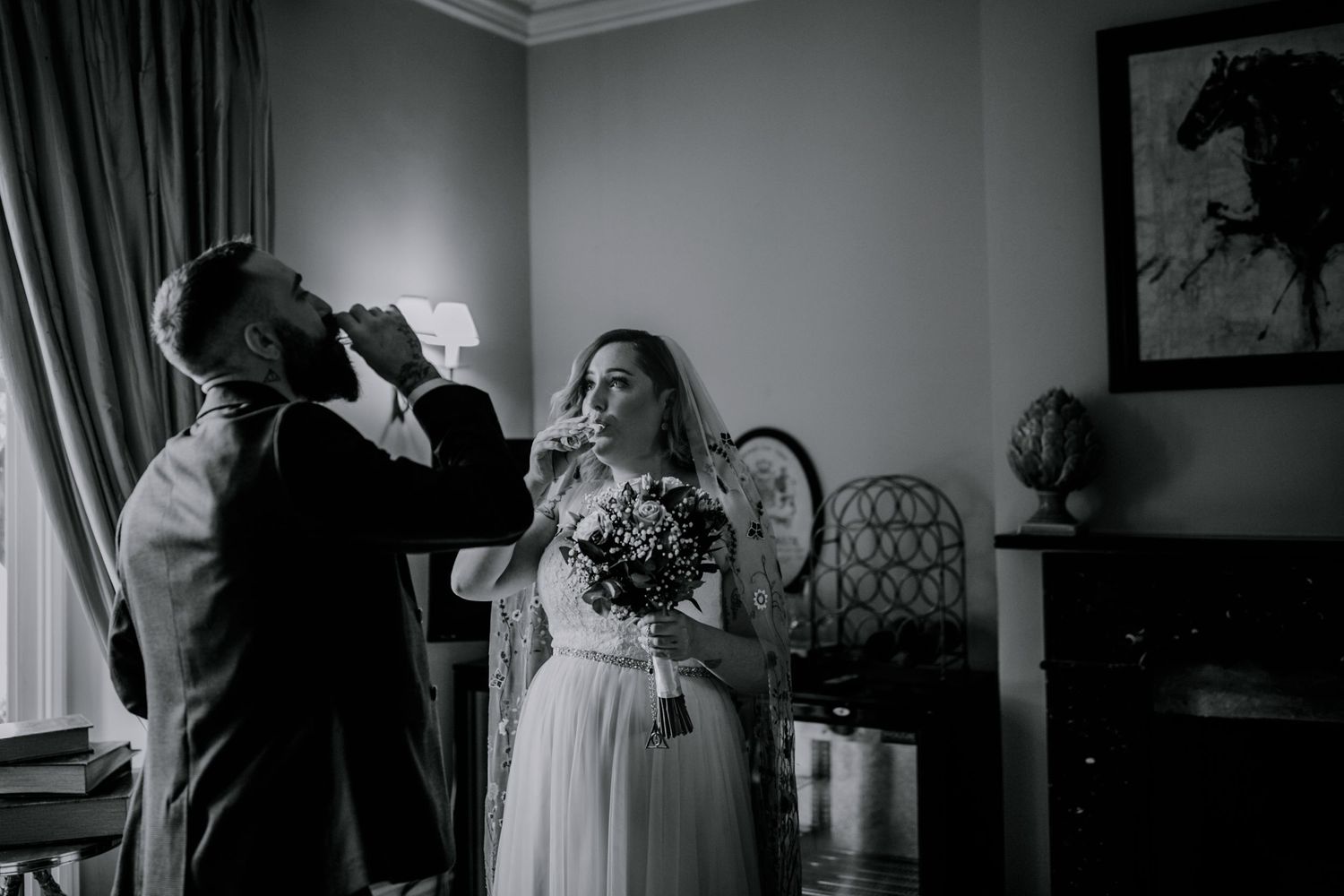 A quiet moment before the vows – The bride and groom meet and take tequila shots before their ceremony