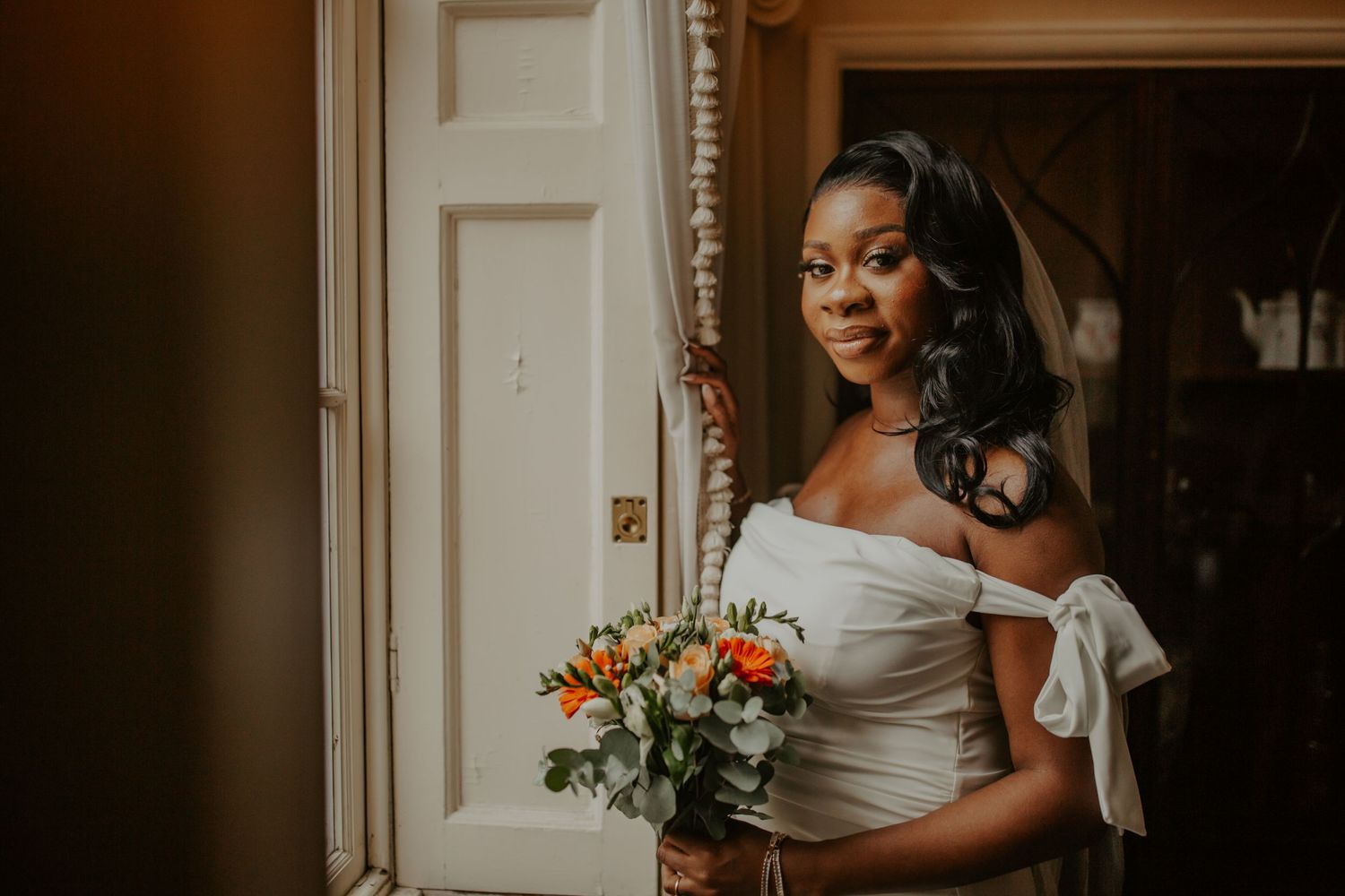 Bride posing by the window at Morden Park House - London - RELM Photography