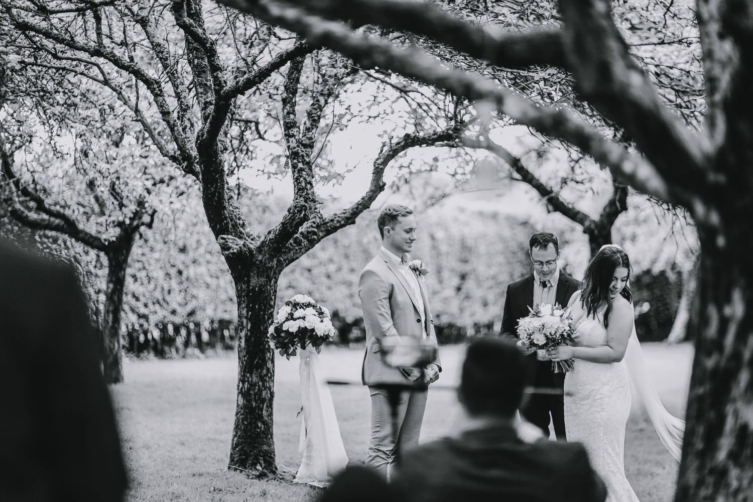 Bride and groom having a wedding ceremony in the woods of Harpenden, Hertfordshire - RELM Photography