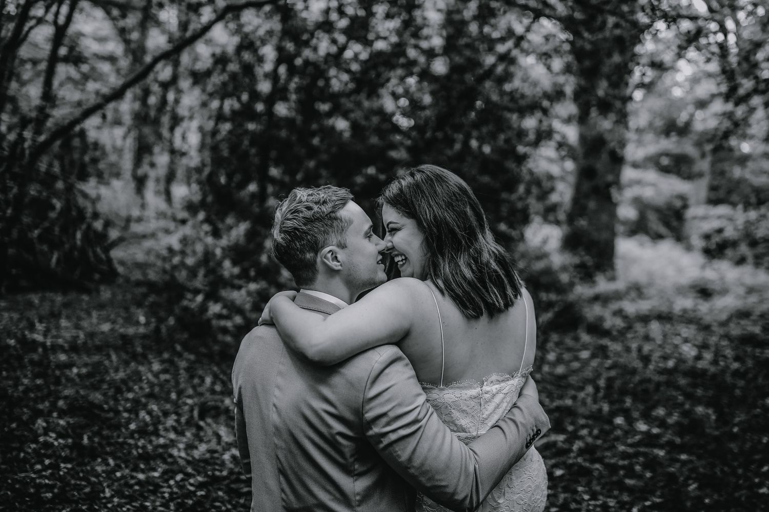 Bride and groom posing in the woods of Harpenden, Hertfordshire - RELM Photography
