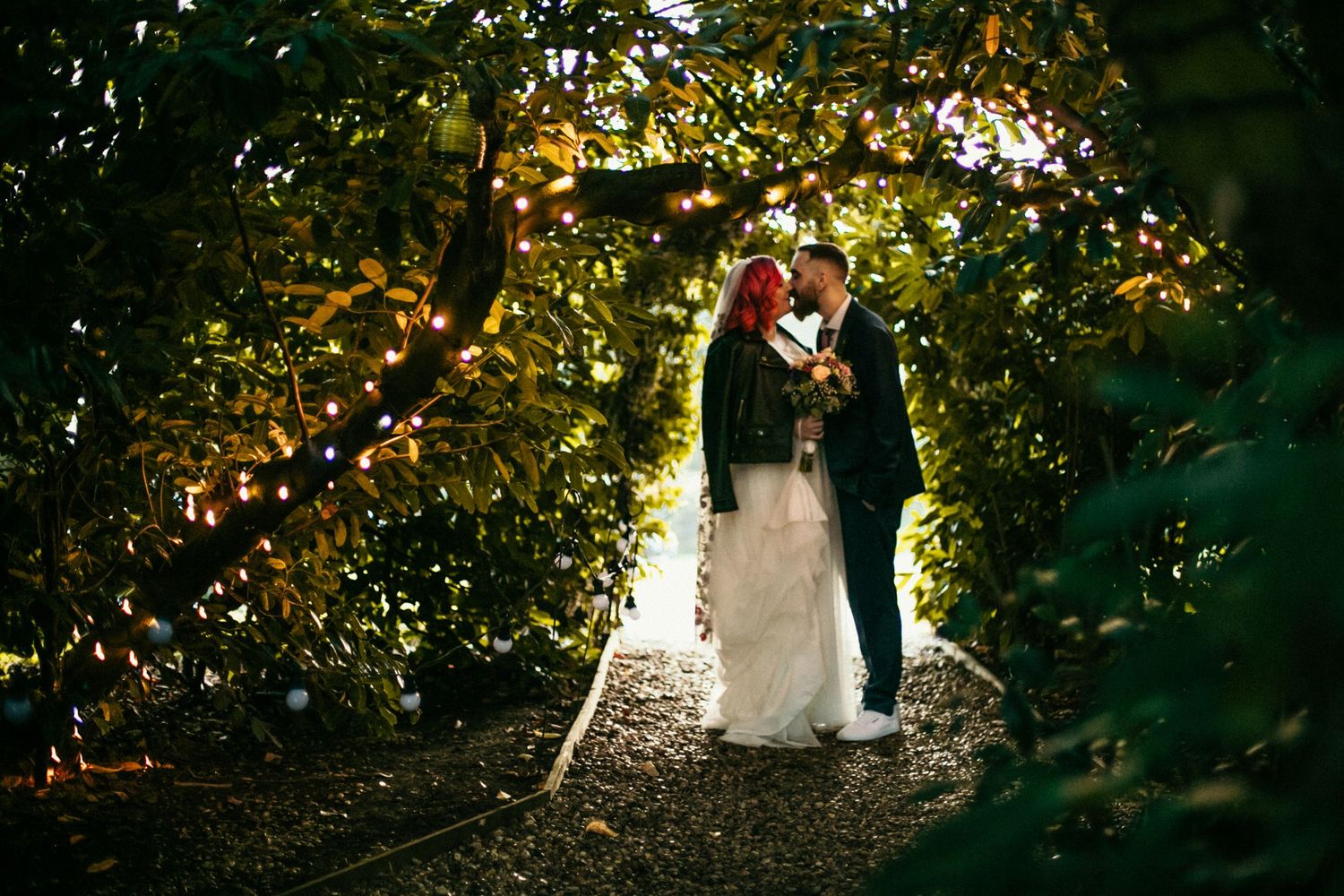 Secret kisses under the fairy light trees