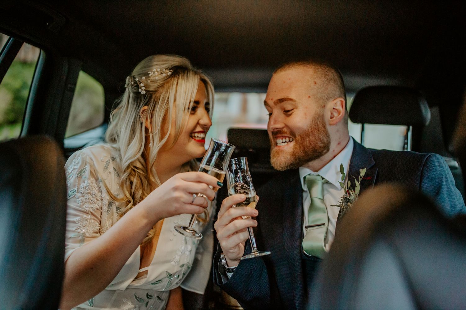 Groom toasting to their marriage in their wedding car, Hertfordshire – RELM Photography.