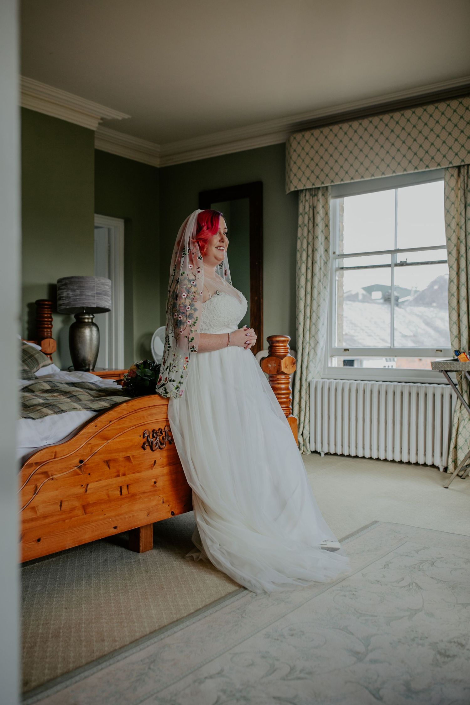 Excitement builds – The bride takes a deep breath, ready to step into her wedding day.