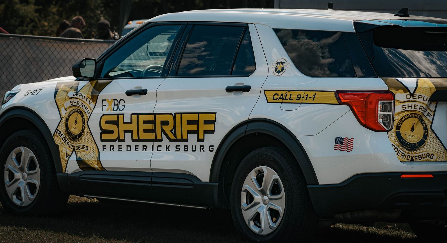 Fredericksburg Sheriff department Ford Explorer police SUV with badge decal and 911 text.