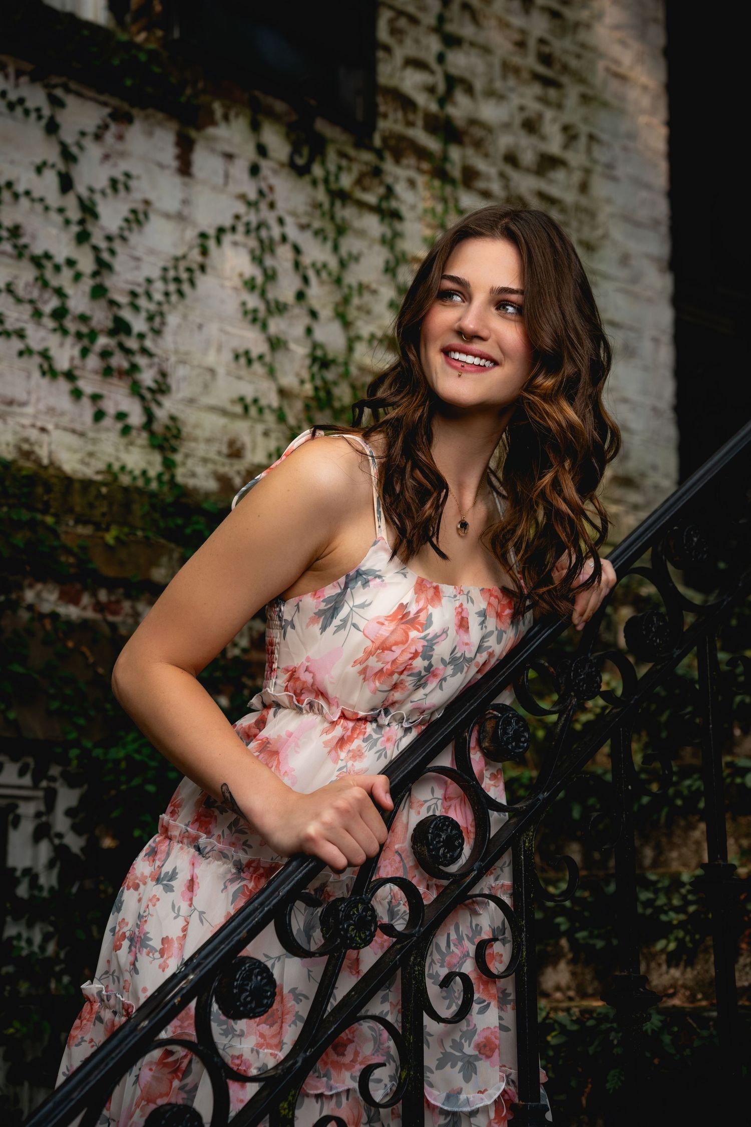 Graduation portrait photography in Savannah featuring natural light and historic architectural scenery by GoodnRich Photography
