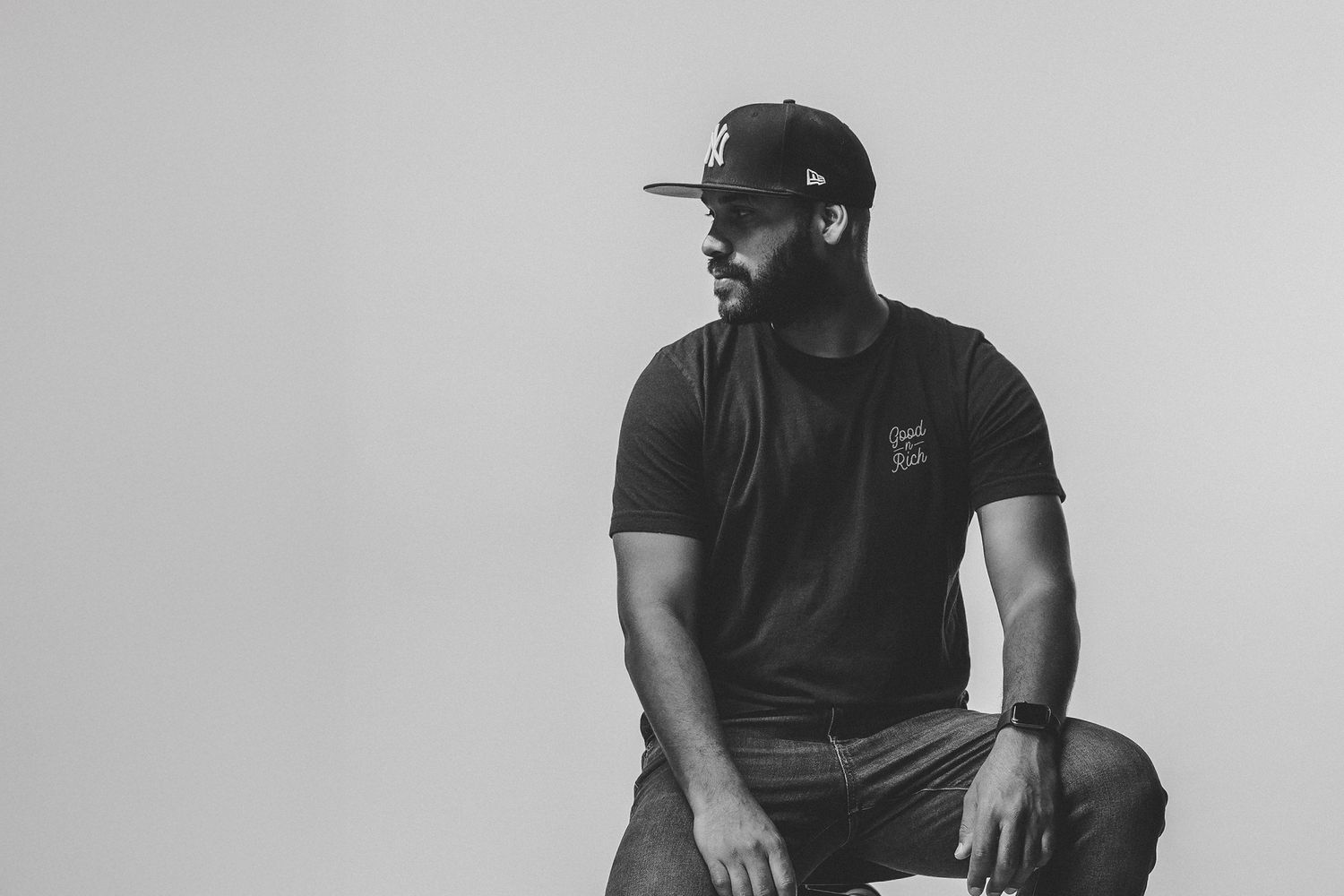 Black and white portrait photography featuring photographer Miguel Mightygoodridge captured with clean studio lighting by GoodnRich Photogra