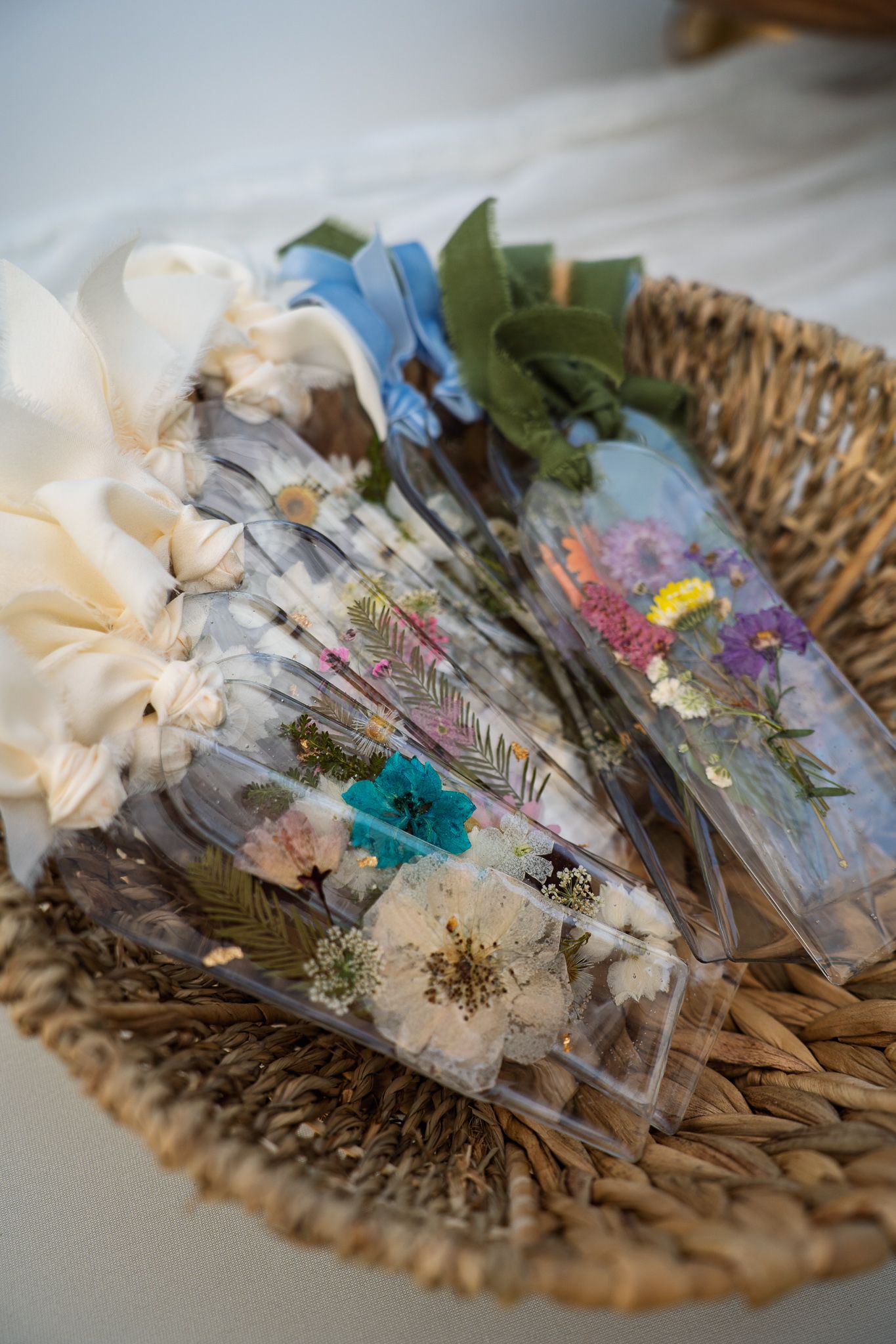 Pressed flower botanical keepsakes displayed at the Salt + Stem vendor booth during Bluffton Farm and Flea in Bluffton, South Carolina.
