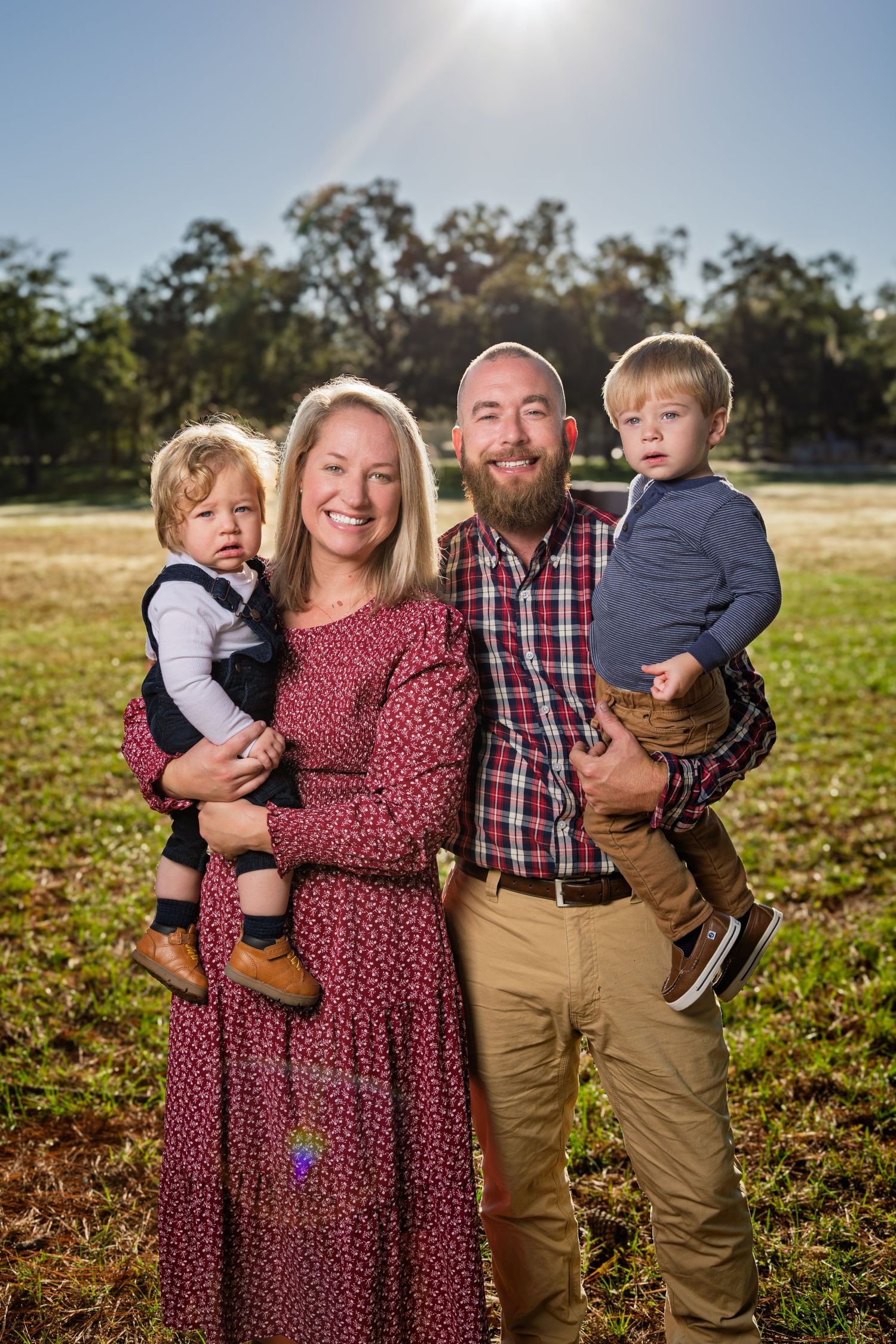 Family lifestyle photography session in Bluffton featuring a family of four captured outdoors with natural golden hour lighting