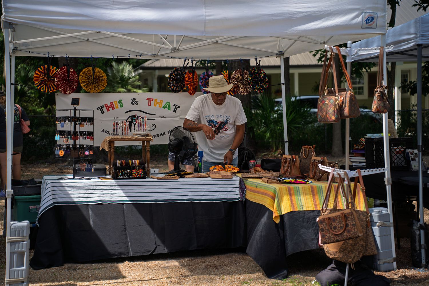 This and That African Merchandise Shop displays handcrafted accessories and handbags during Bluffton Farm and Flea in Bluffton, South Caroli
