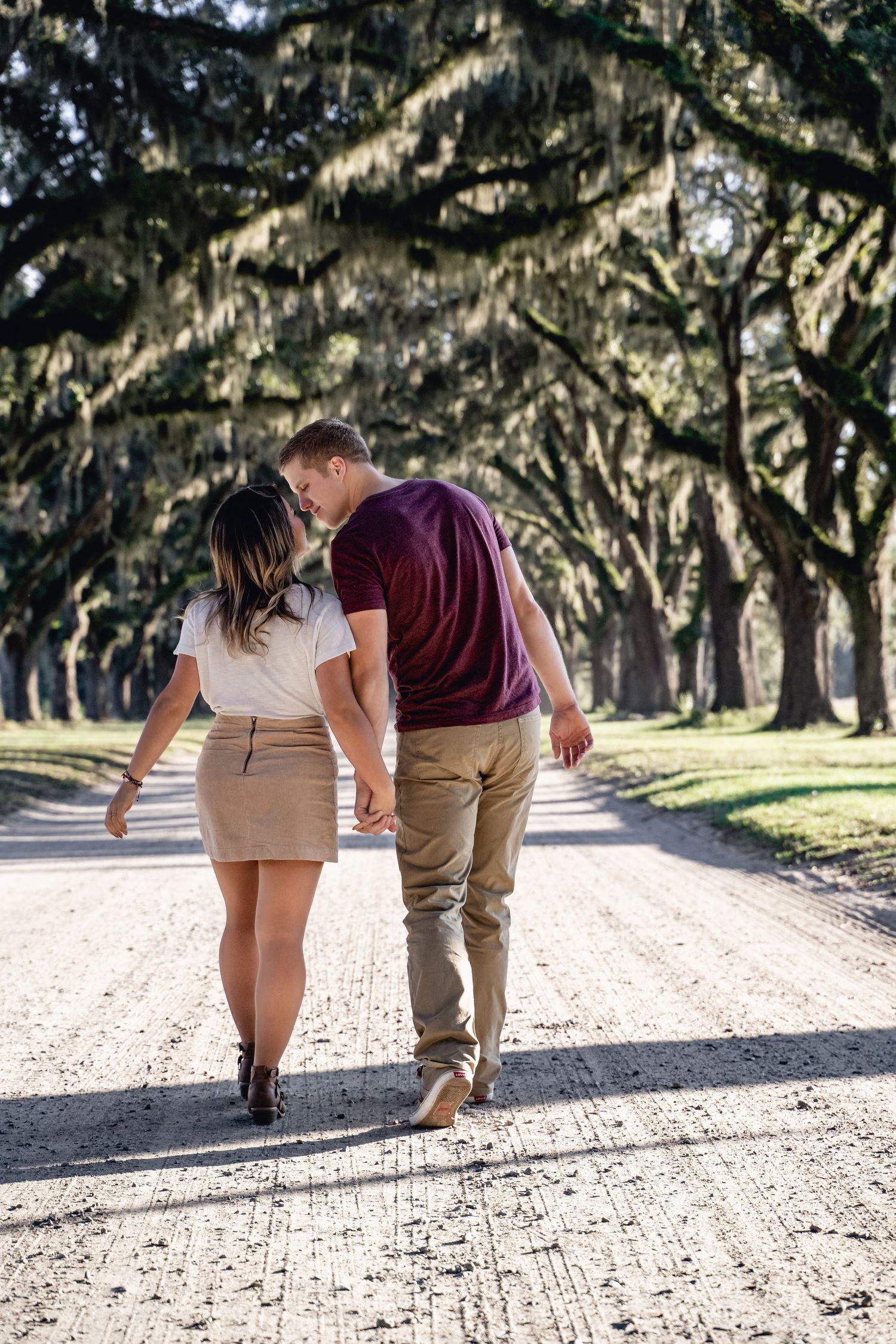 Couples lifestyle photography in Bluffton featuring romantic moments beneath iconic Lowcountry oak trees by GoodnRich Photography