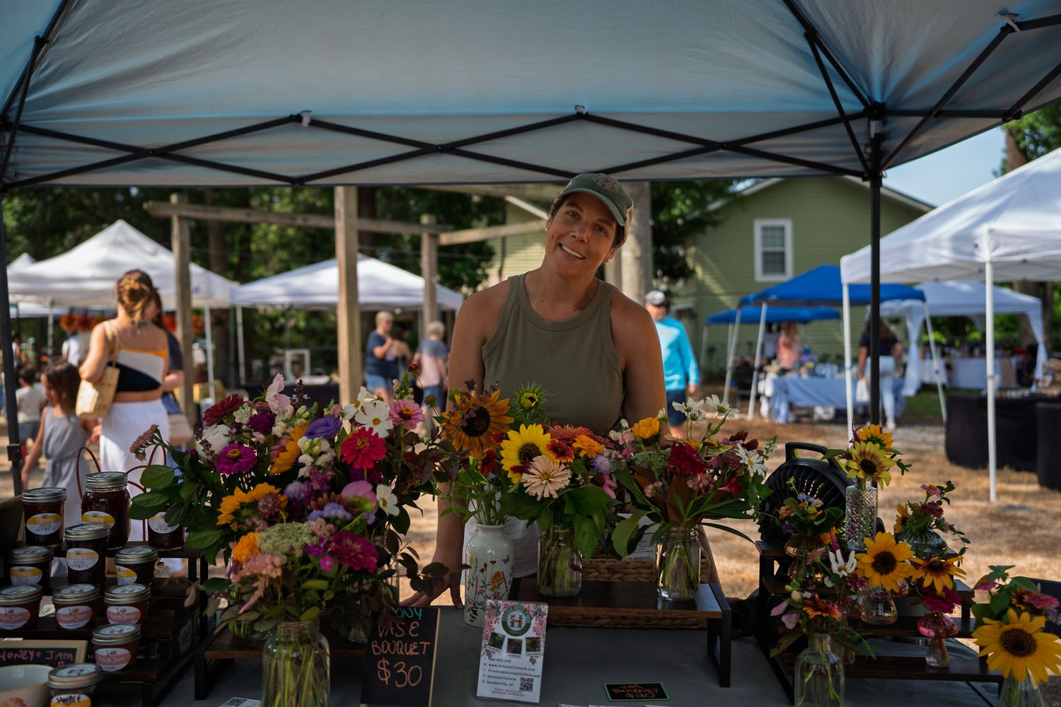 Fresh flower arrangements on display at the Helena Hills Farm vendor booth during Bluffton Farm and Flea’s grand opening.