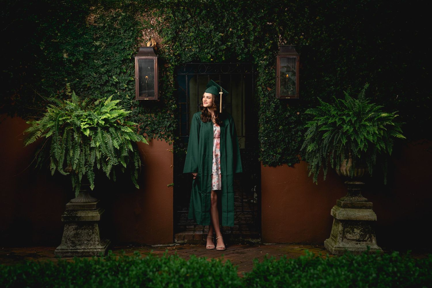 Graduation portrait photography in Savannah featuring a graduate framed by historic architecture and cinematic lighting by GoodnRich