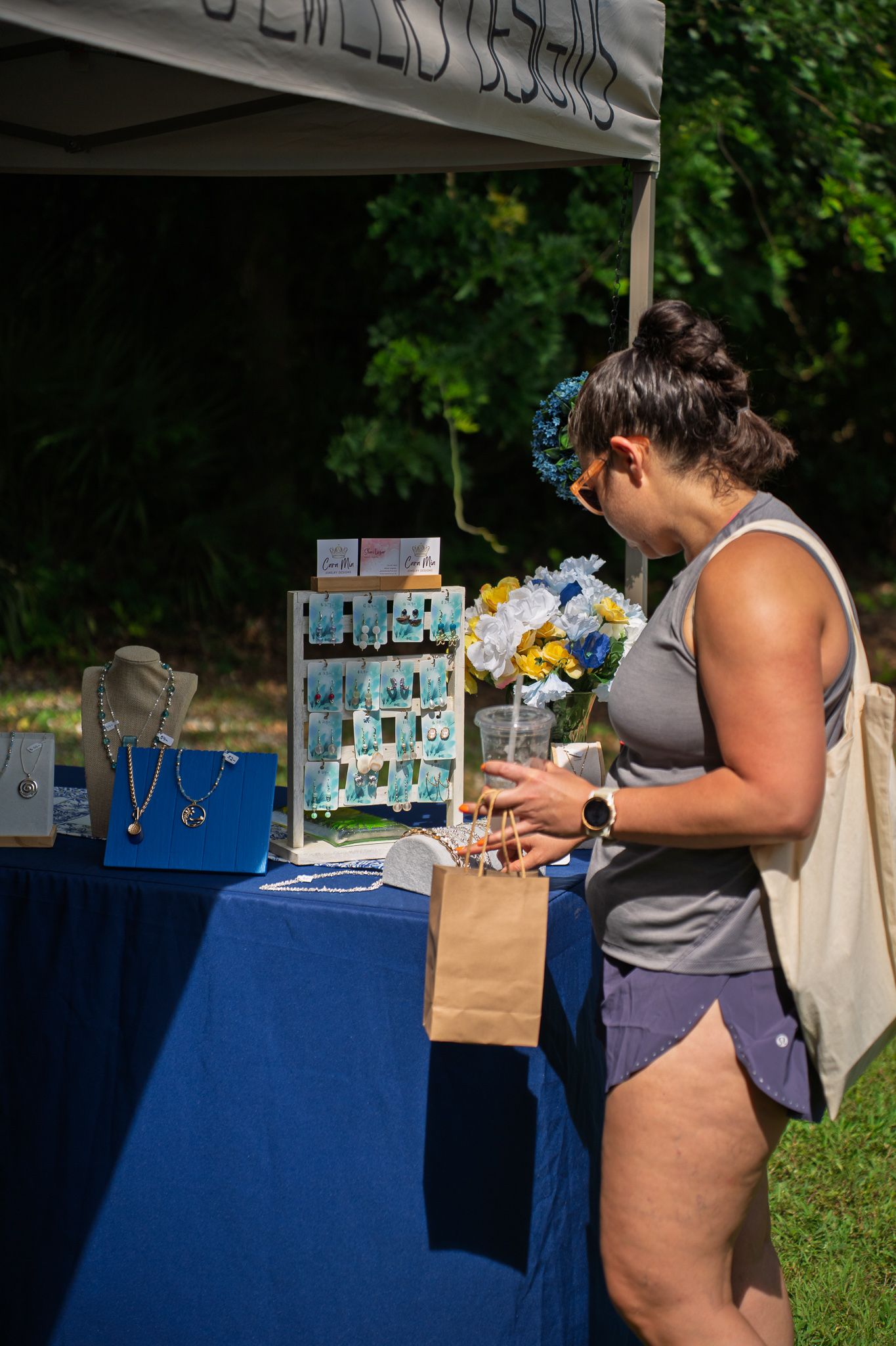 A shopper browses handcrafted pottery and ceramic artwork from a local artisan during Bluffton Farm and Flea in Bluffton, South Carolina.