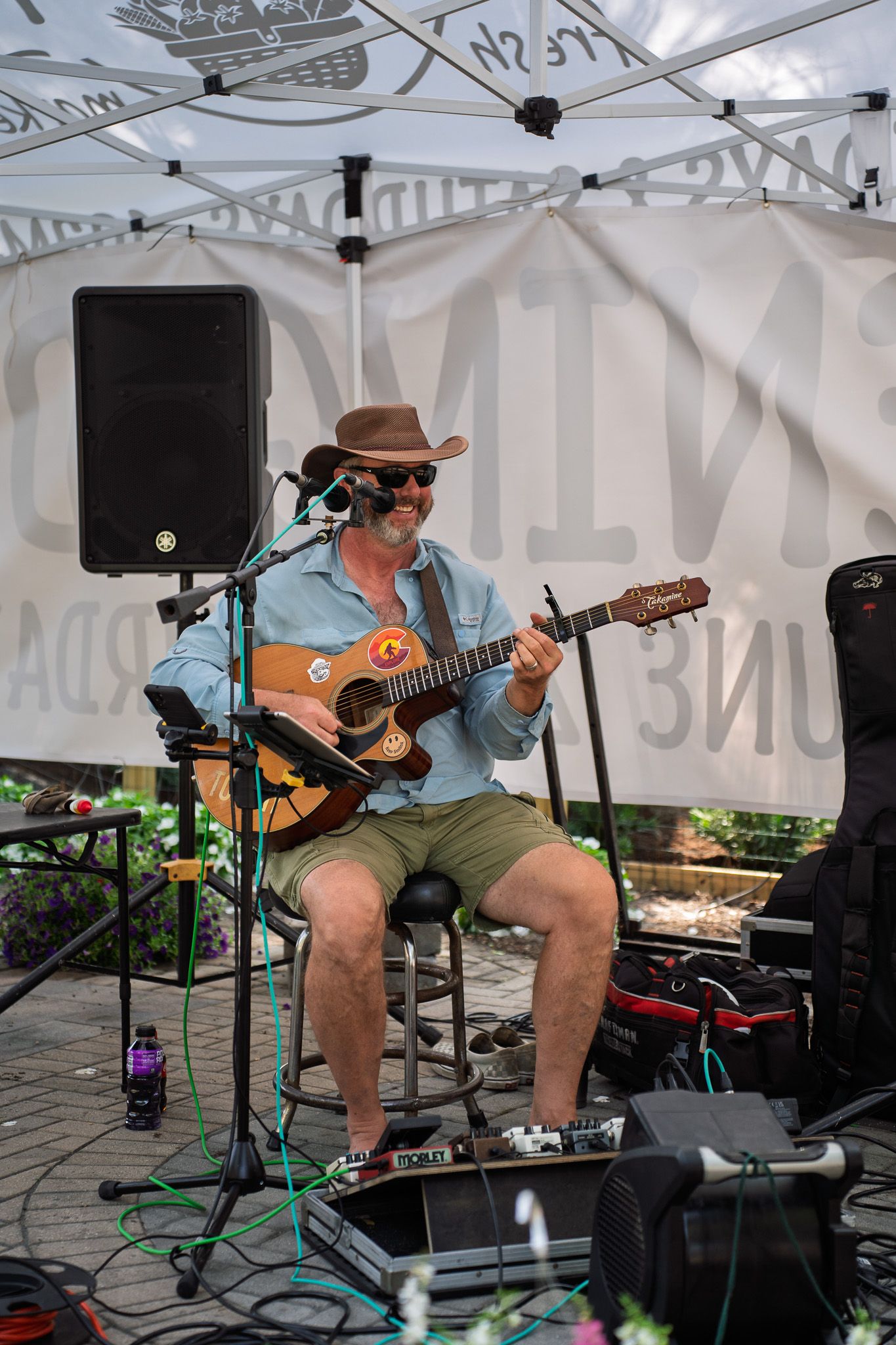 A local musician performs live music during the grand opening celebration at Bluffton Farm and Flea in Bluffton, South Carolina.