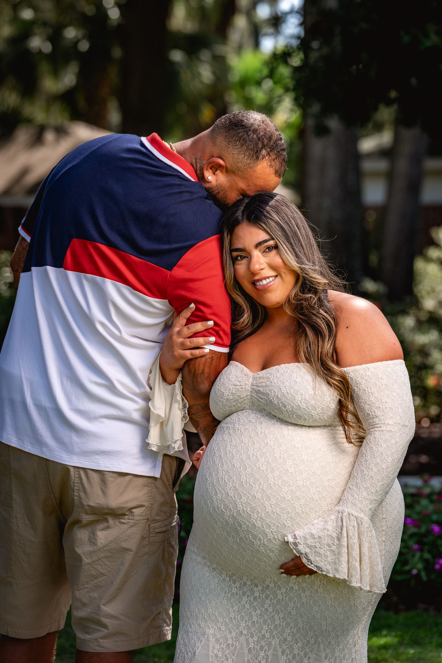 Maternity lifestyle photography session captured outdoors with natural connection and soft lighting by GoodnRich Photography