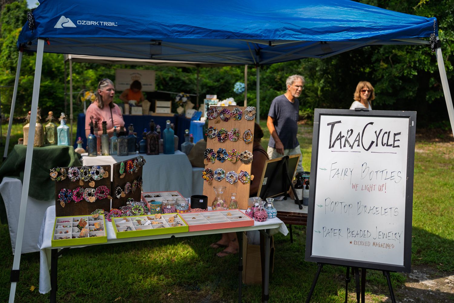 The TaraCycle vendor booth displays handmade fairy bottles, bracelets, and recycled art during Bluffton Farm and Flea in Bluffton, South Car