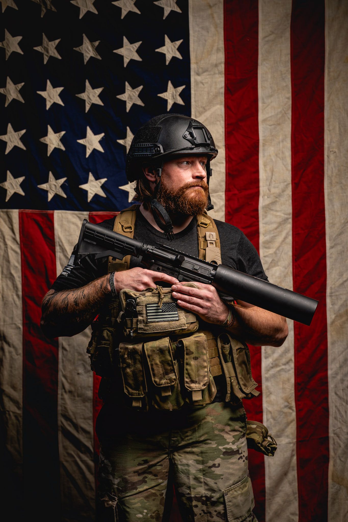 Side-angle portrait of veteran aiming the Can Cannon during a New Year’s Nine Line Apparel promotional photoshoot.