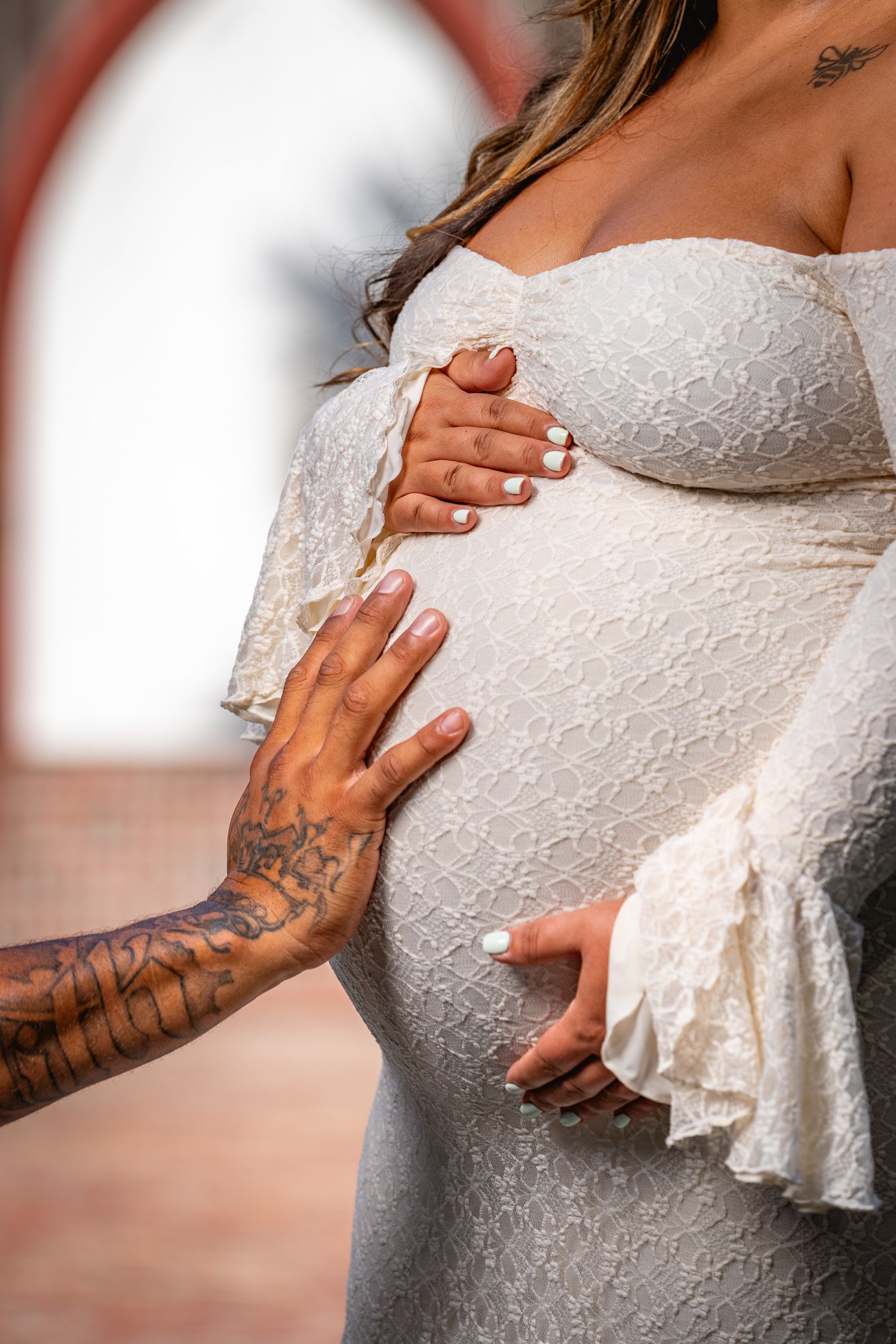 Close up maternity photography detail captured in Old Town Bluffton featuring intimate connection and natural light by GoodnRich Photography