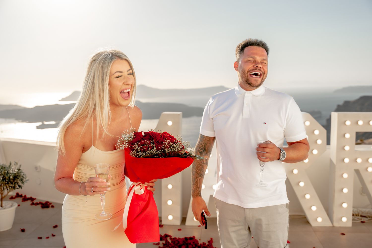 Bride saying yes during a sunset proposal in Santorini venue, joyful and intimate 🌅