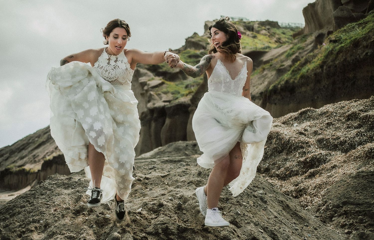 Romantic elopement photoshoot in Santorini, capturing fun moments, authentic connection, and scenery