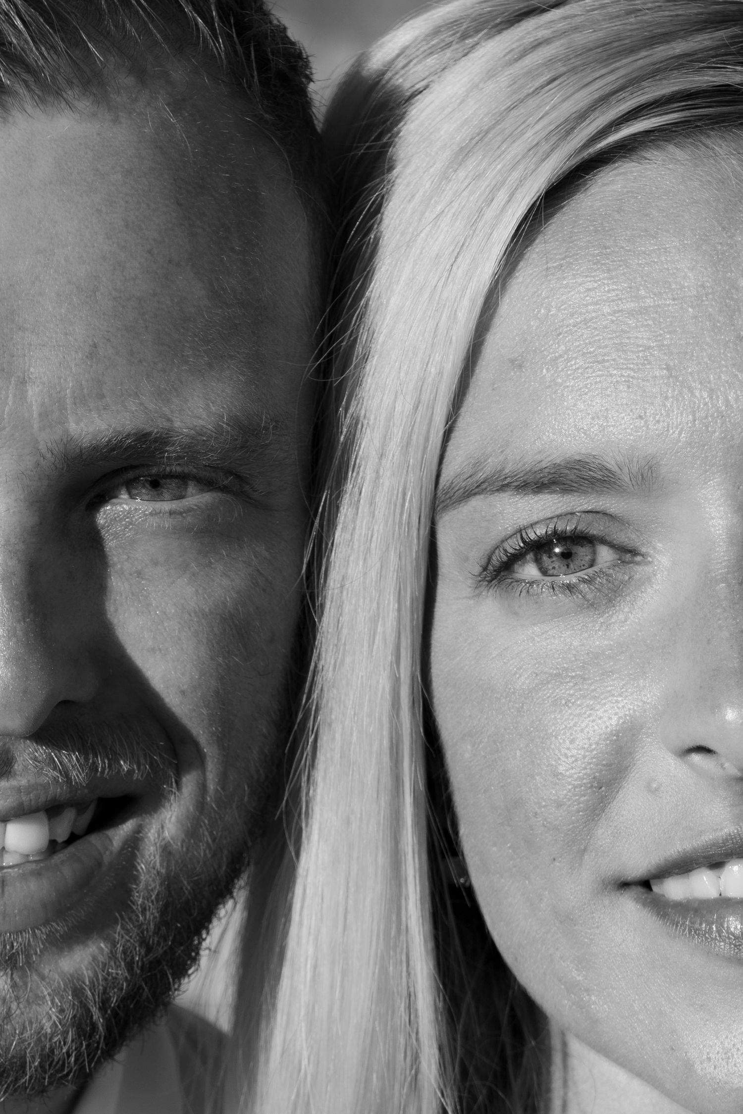 Couple's close-up portrait embracing  a quiet moment on a stone alley, intimate and heartfelt. Blac