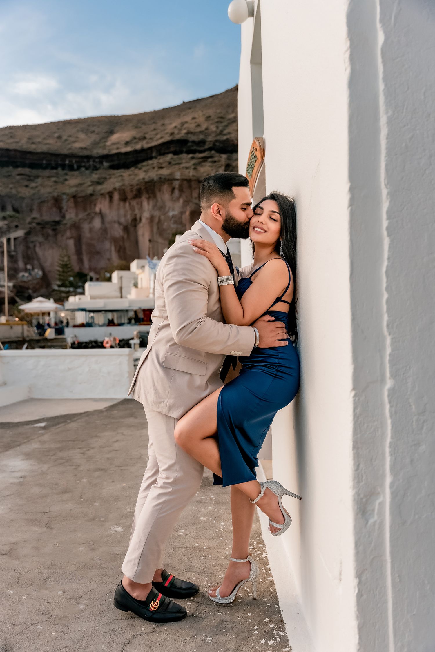Couple embracing after a proposal in Santorini, romantic and joyful. Couple hugging, romantic and full of emotion