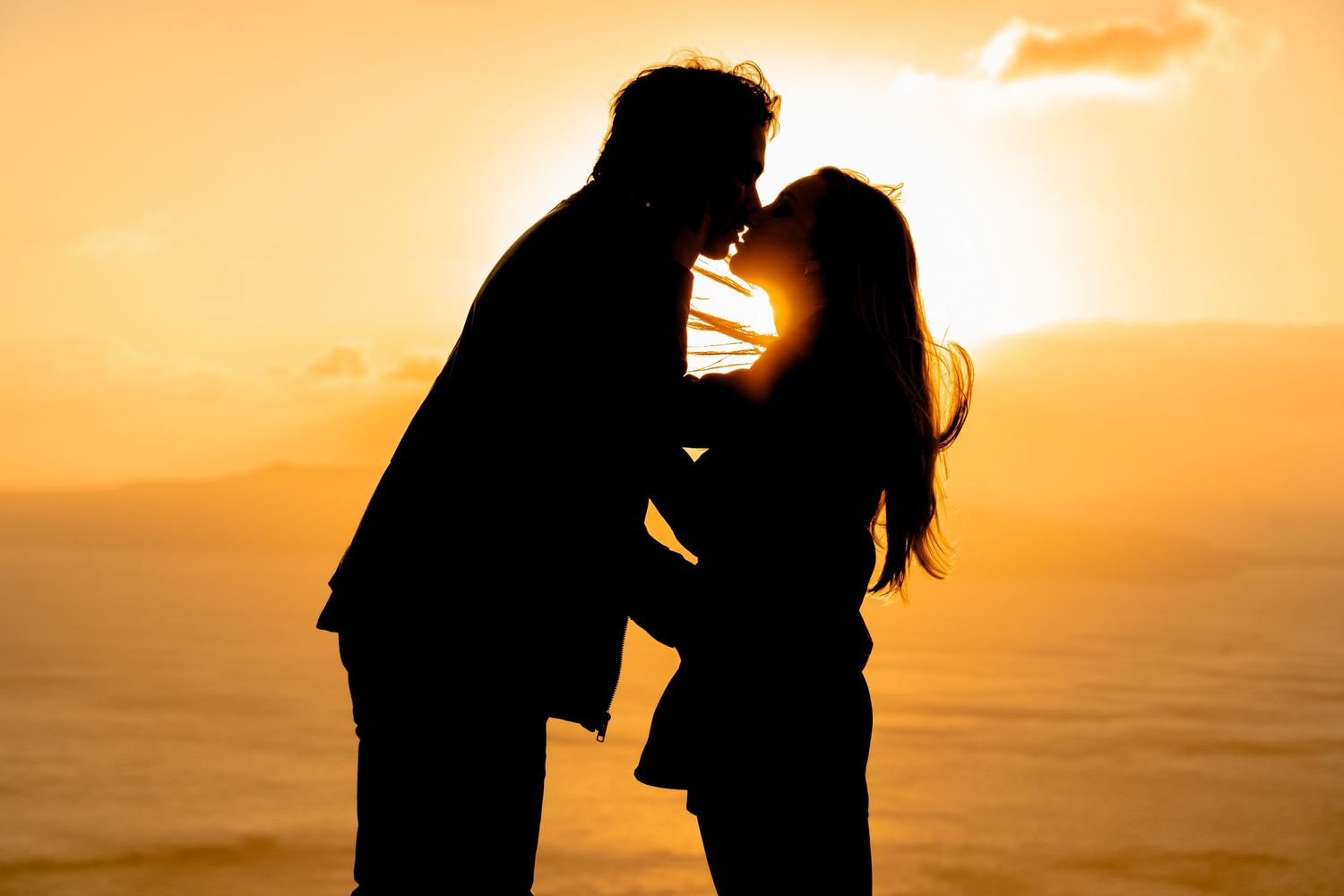 Bride saying yes, and kissing during a sunset proposal on a Santorini terrace, joyful and intimate 🌅