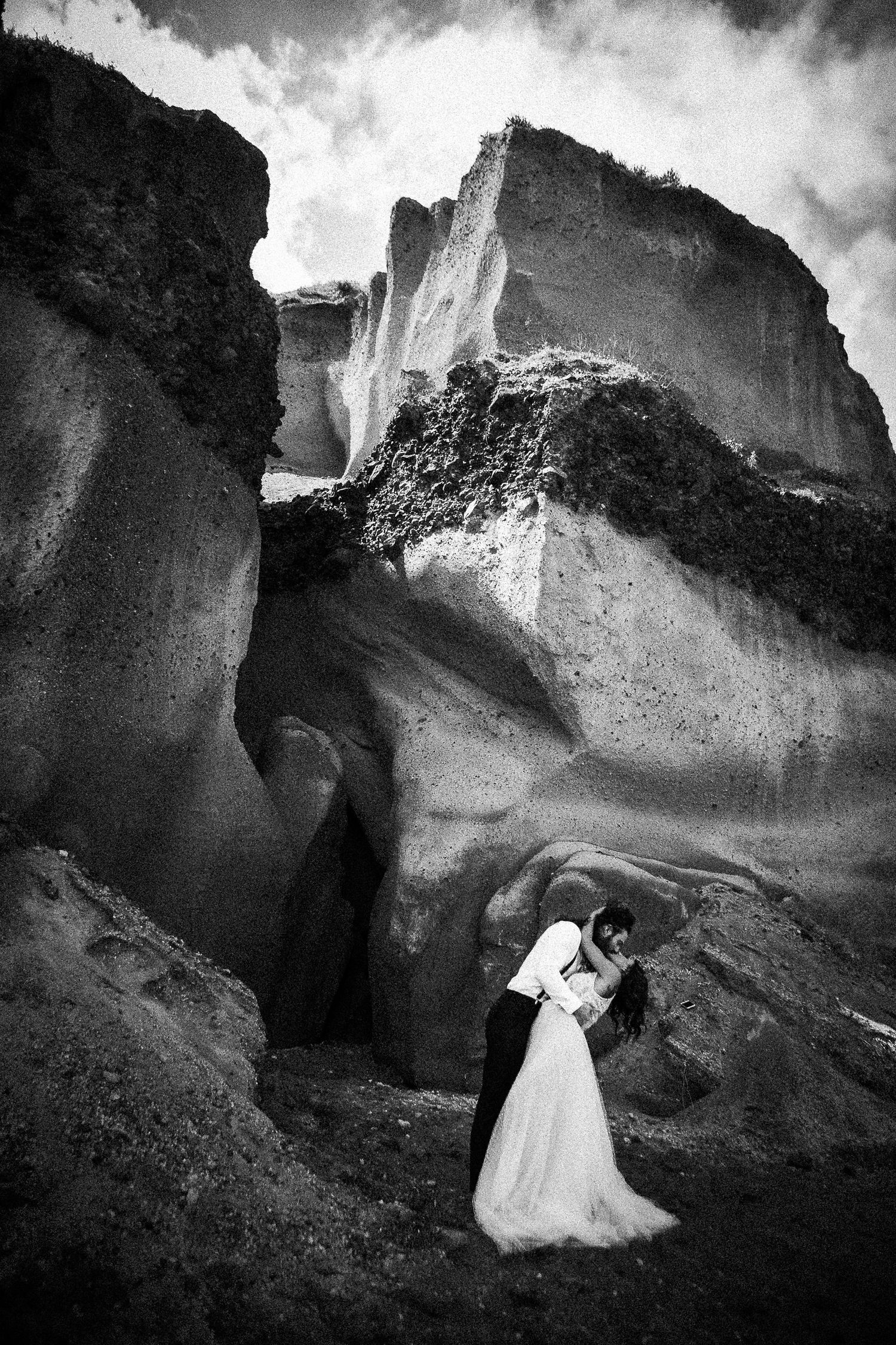 Romantic elopement photoshoot in Santorini, capturing authentic connection and scenery