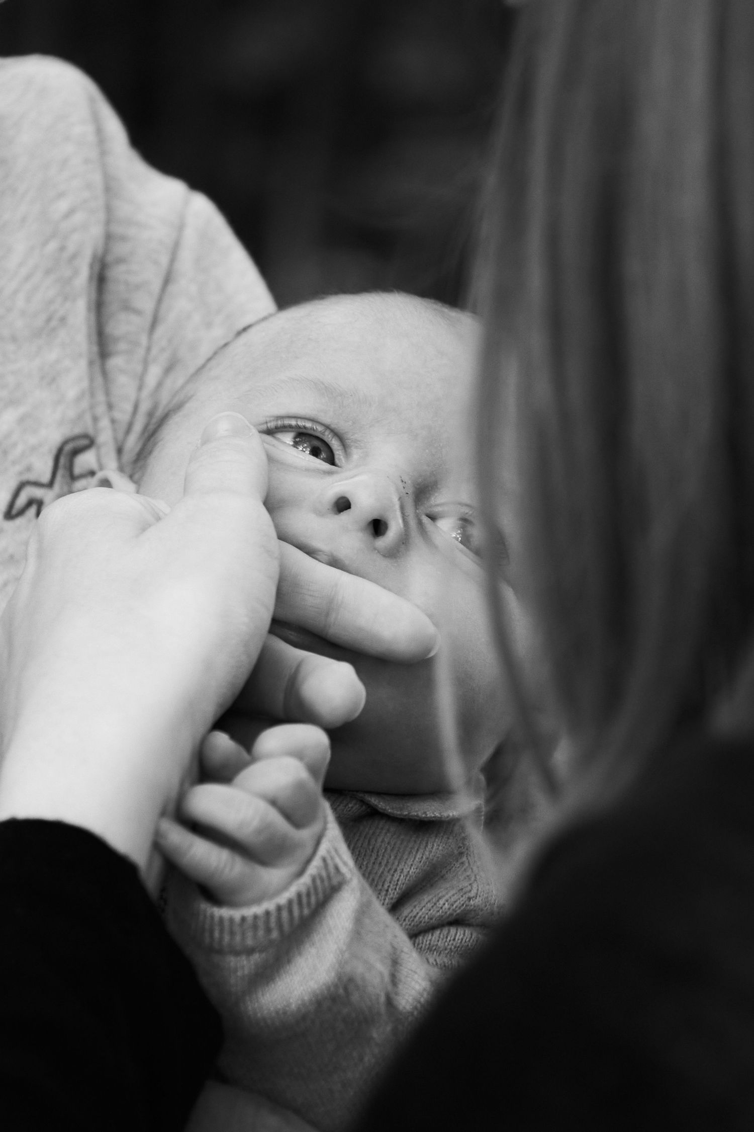 Black and white close-up portrait showing expressions of joy.