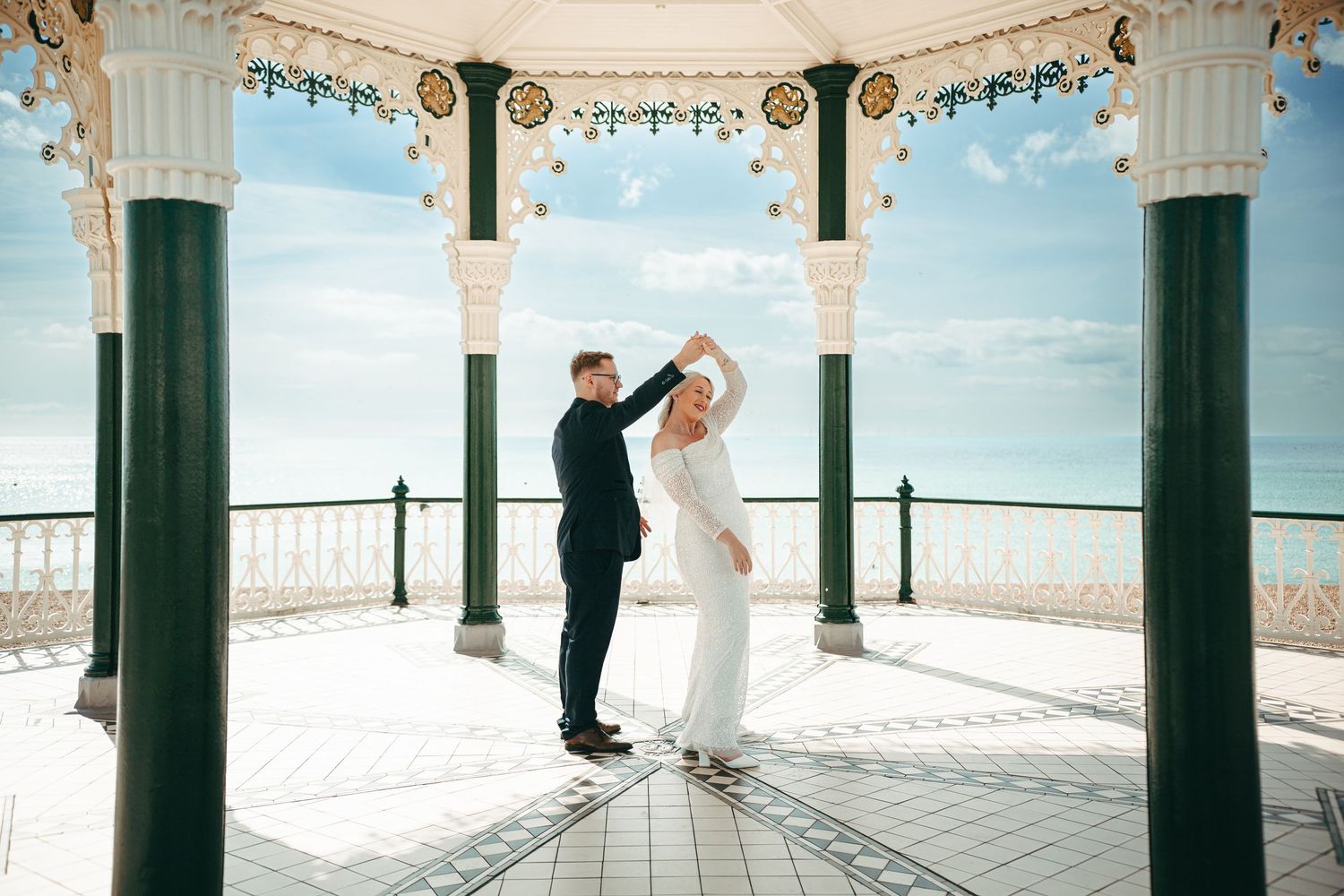 A wedding couple in the Bandstand on Brighton Beach for some relaxed portraits