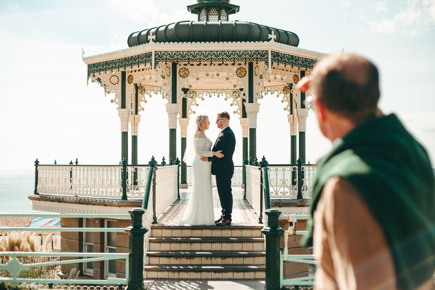 A wedding couple in the Bandstand on Brighton Beach for some relaxed portraits