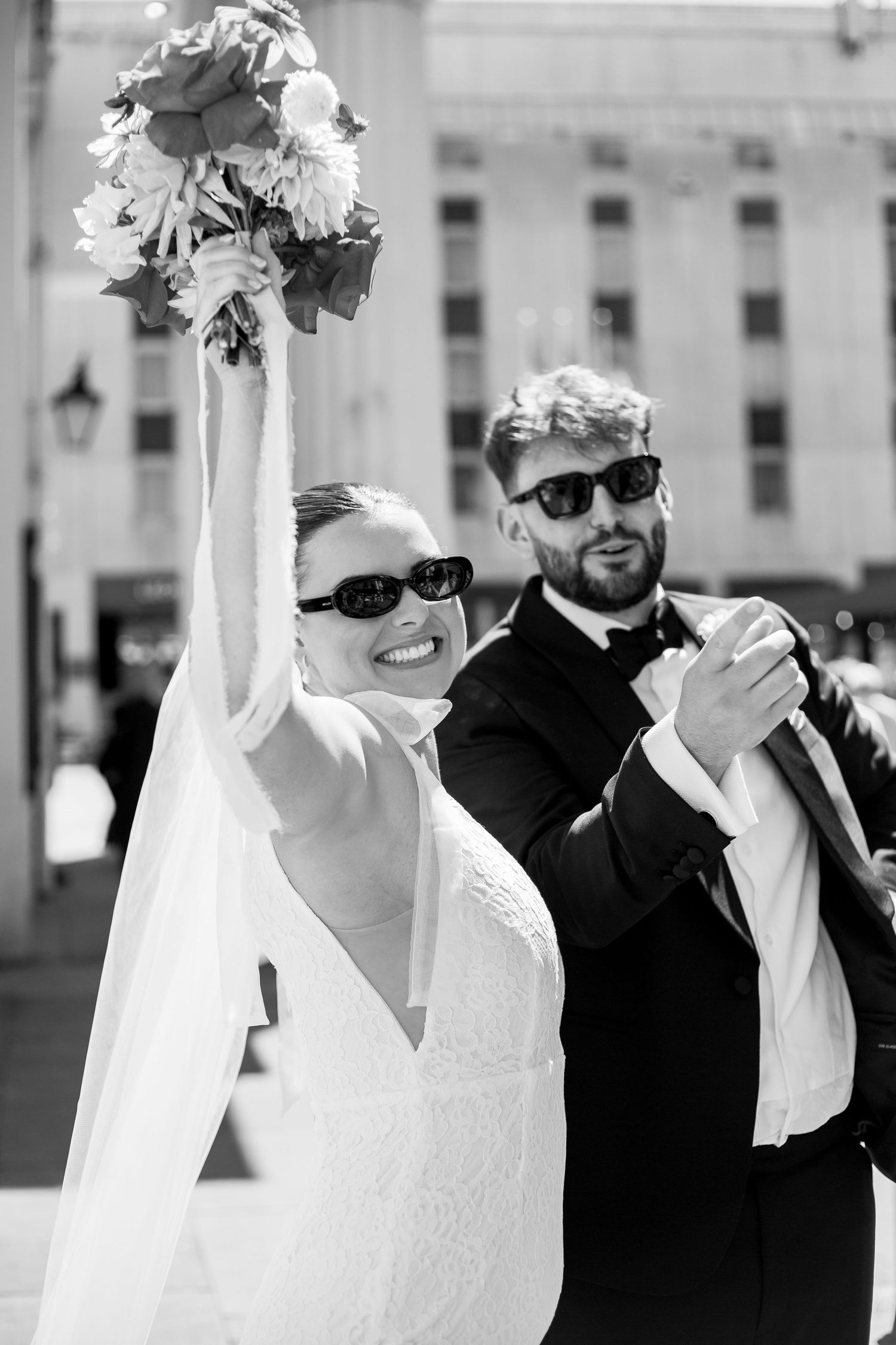 A wedding couple celebrate outside Brighton Town Hall