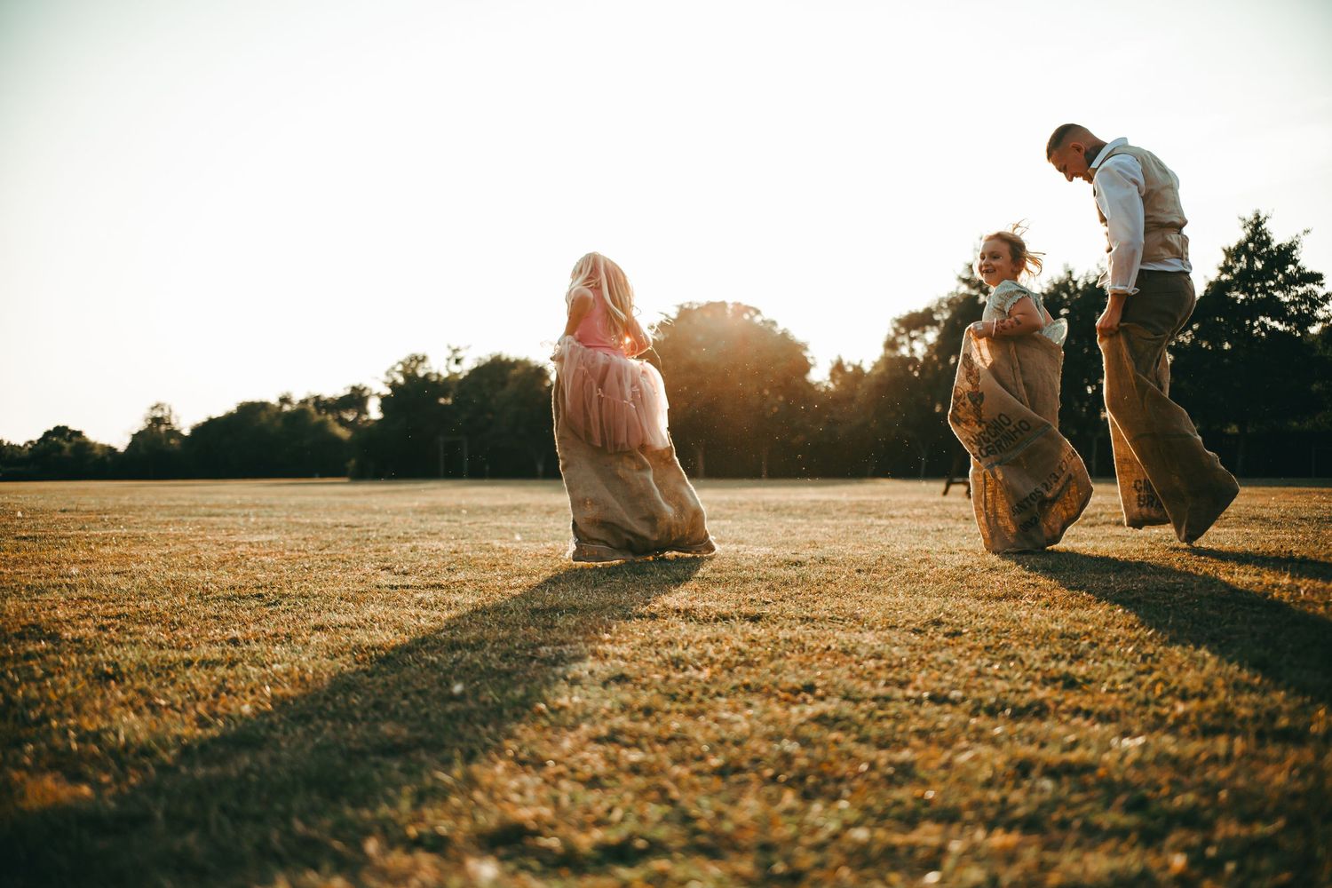 A wedding reception with some fun for the guests - a sack race at Barnham Community Hall Field.