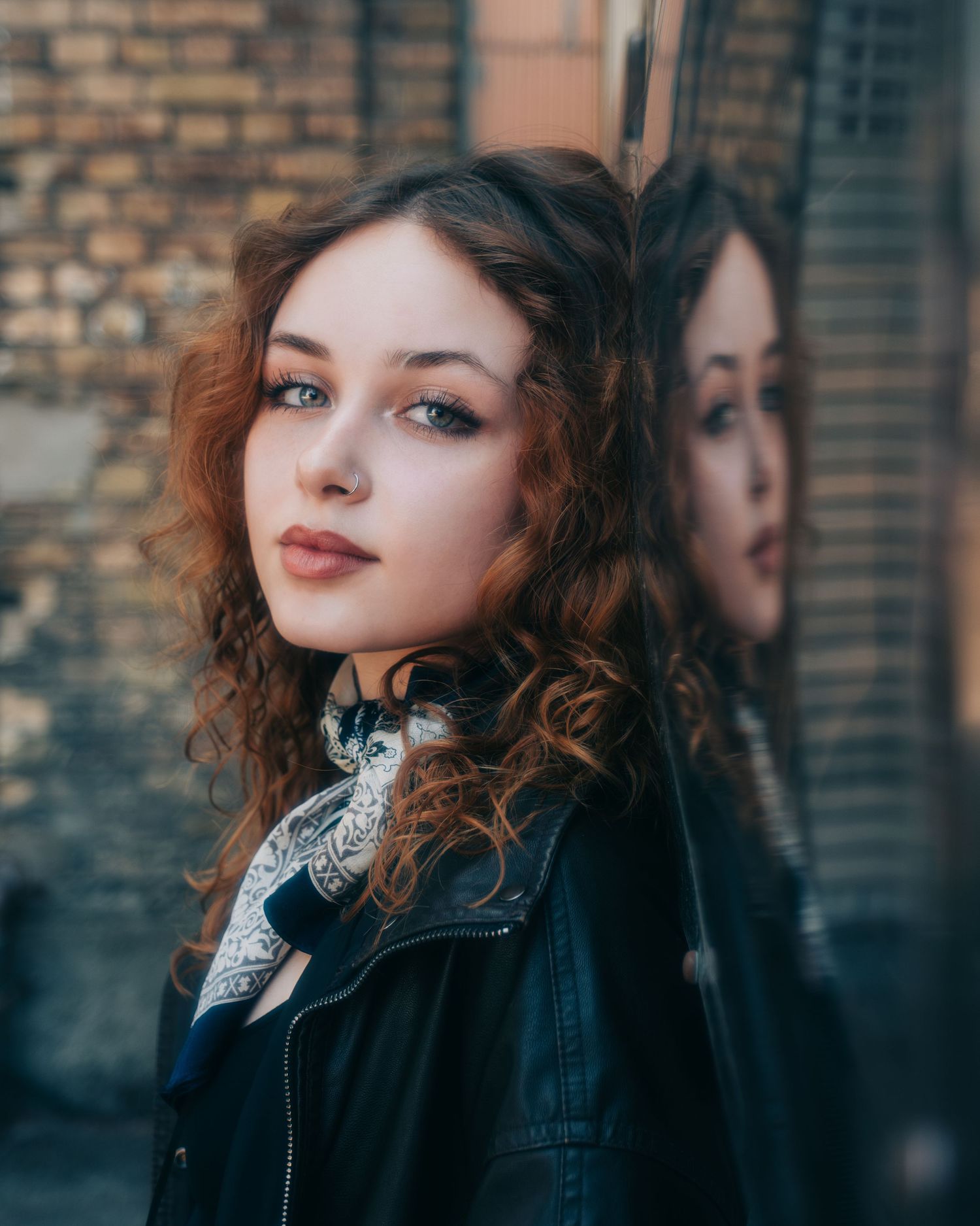 Fashion series featuring leather jacket and ornate collar detail against urban backdrop.