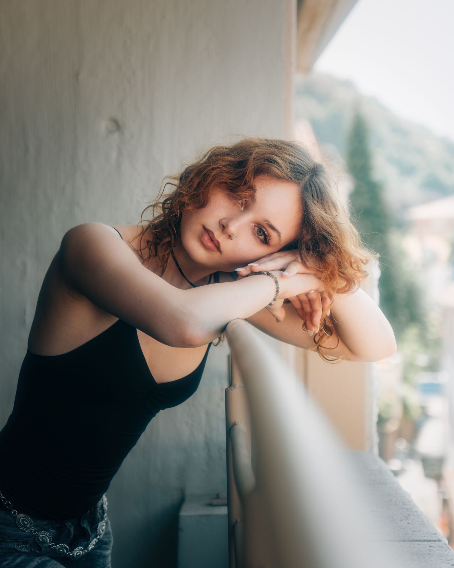 Soft natural light portrait series with minimalist white background and gentle shadows.