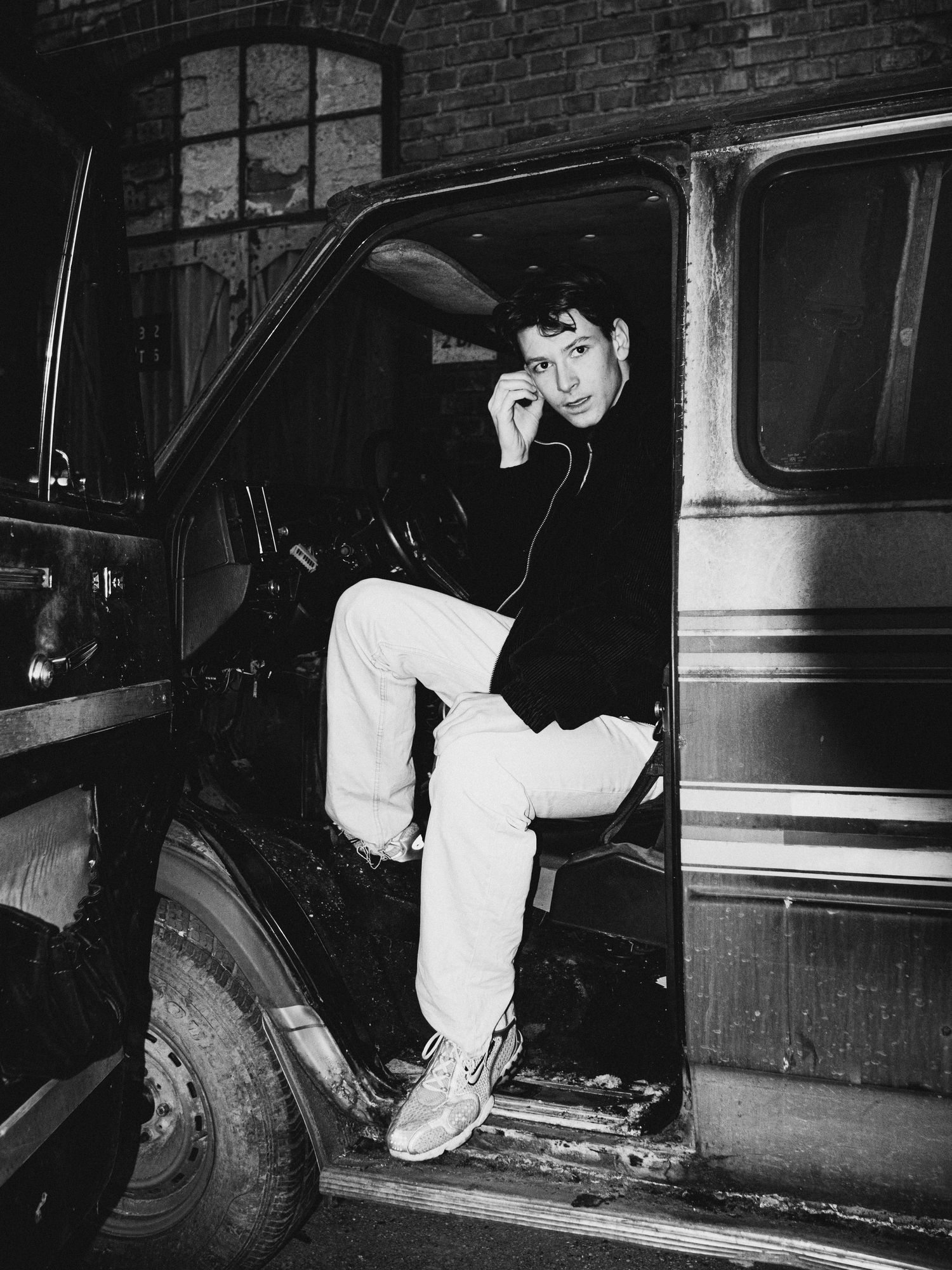 Series of noir-style photographs showing exploration around a vintage car in low light.