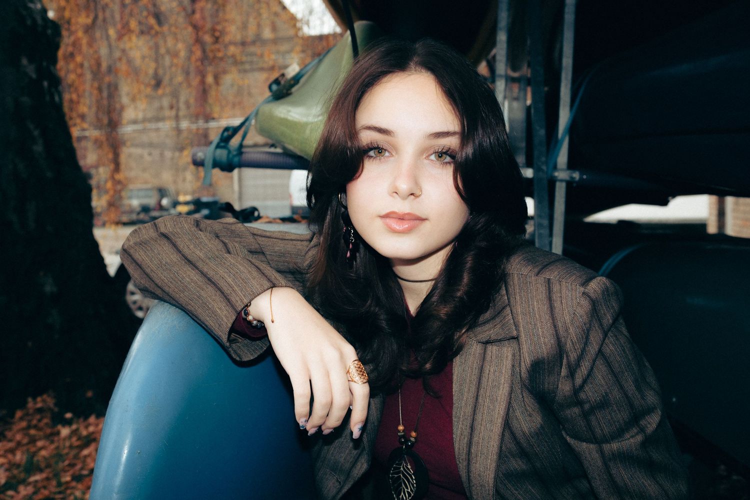 Moody portrait sequence against industrial brick backdrop.