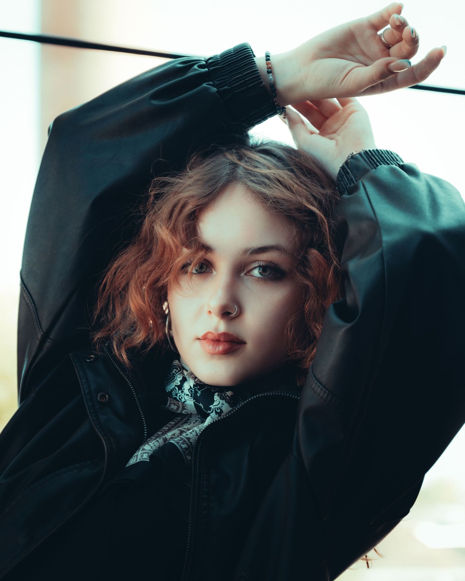 Artistic fashion portrait sequence with dramatic lighting and black clothing.