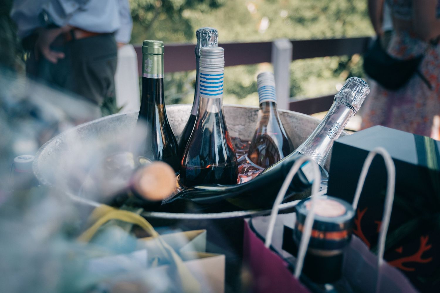 Close-up details of outdoor dining setup with glassware and drinks.