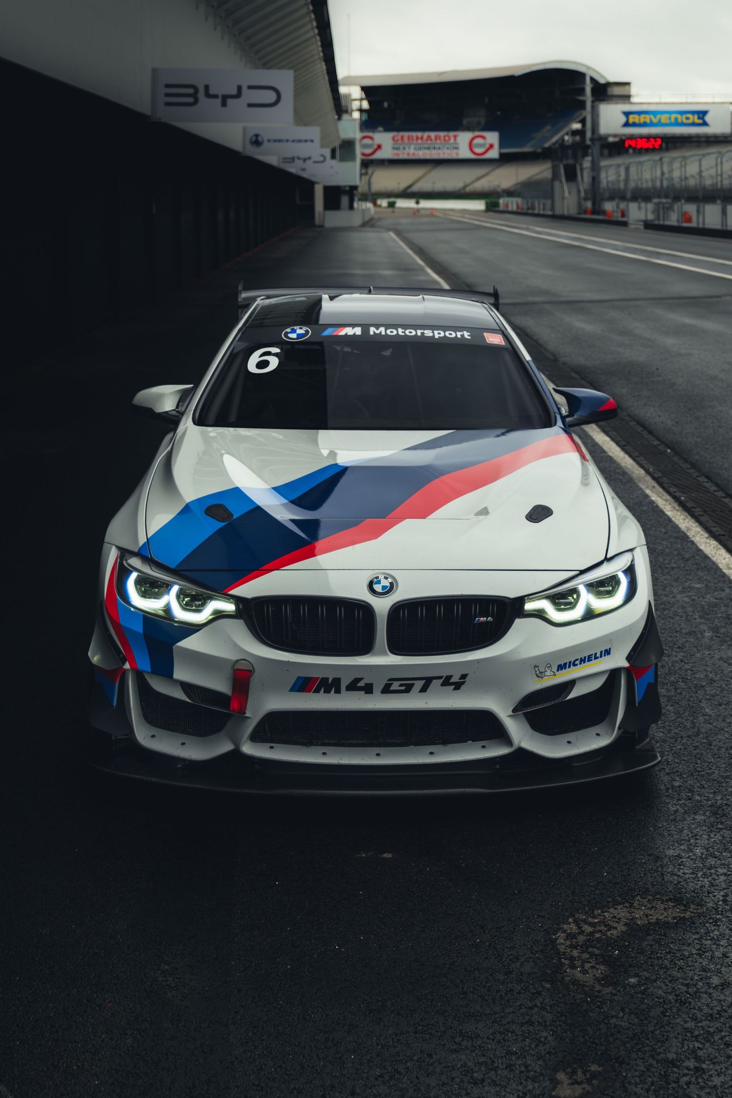 Front view of BMW M4 GT3 race car displaying iconic M Motorsport livery on wet track.